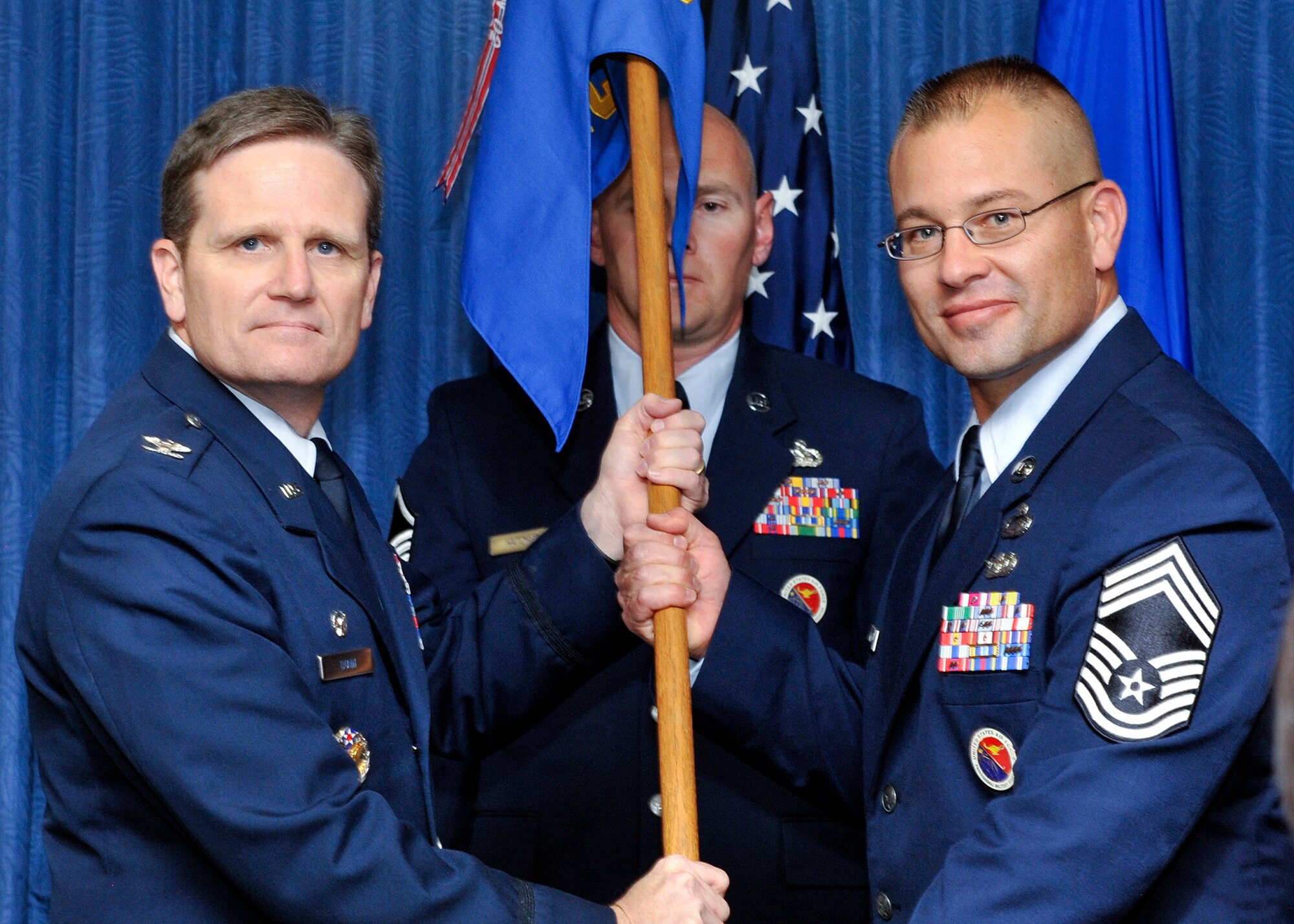 PETERSON AIR FORCE BASE, Colo. – The Vosler NCO Academy held an assumption of command ceremony Oct. 27, where Col. Jefferson Dunn (left), Air Education and Training Command Barnes Center for Enlisted Education commander, presented command to Chief Master Sgt. Todd Krulick (right), incoming Vosler NCO Academy commandant. (U.S. Air Force photo/Dennis Howk)