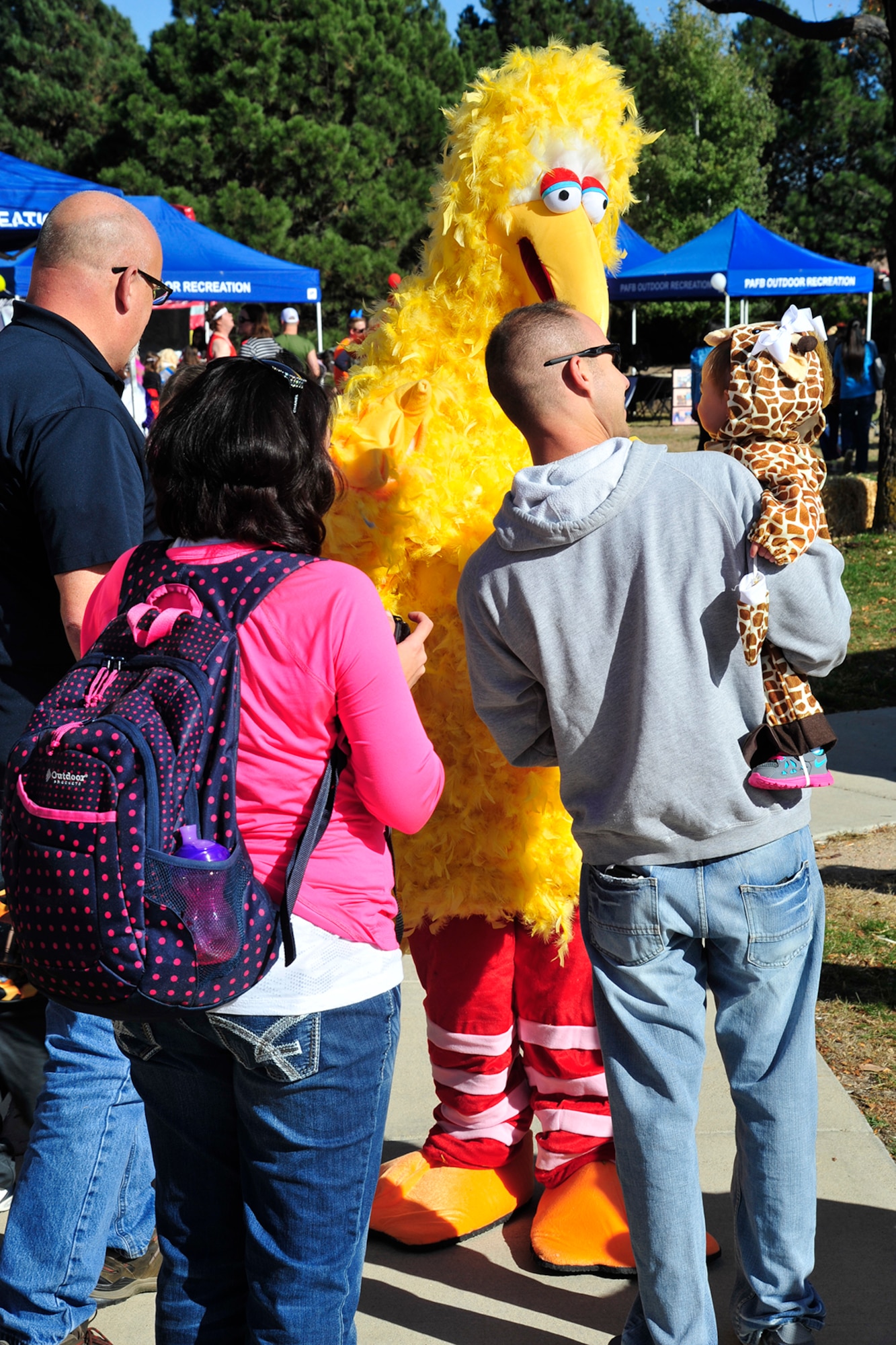 PETERSON AIR FORCE BASE, Colo. — Big Bird was one of the characters entertaining the children at the 21st Medical Group 2014 Fall Festival Oct. 31. Members from the 21st MDG, chapel, the fire department, American Red Cross, Airman and Family Readiness Center, 21st Security Forces Squadron and more provided preventative health information, health and fitness-related games, music and healthy snacks. The health fair and festival was open to all ages. (U.S. Air Force photo/Robb Lingley)