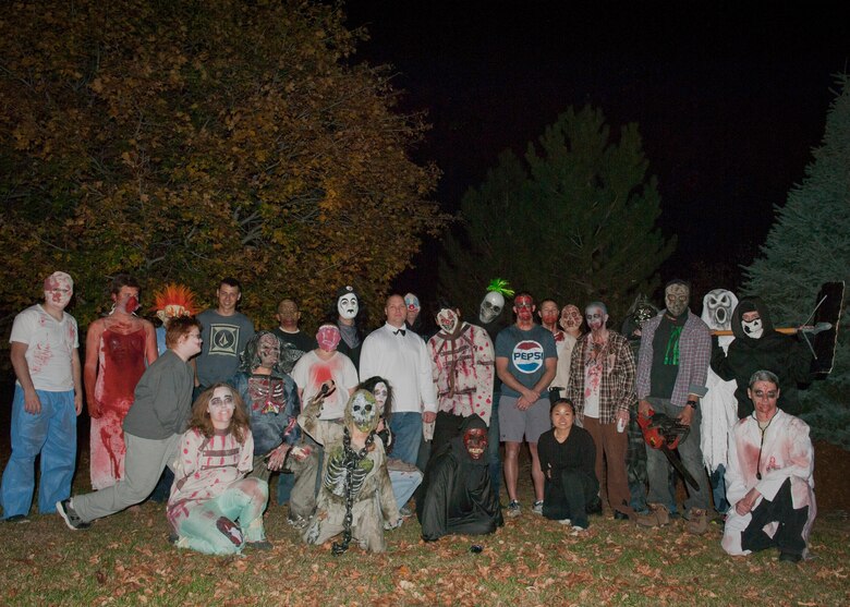 PETERSON AIR FORCE BASE, Colo. – Volunteers at the 21st Communications Squadron haunted house pose for a photo after they were done scaring the kids for the night Oct. 30. This was the first-ever haunted house put on by the 21st CS, and admission was free. Different rooms had different levels of “scare factor,” including a separate kid’s area for those that weren’t quite ready to be scared. (U.S. Air Force photo/Airman 1st Class Rose Gudex)