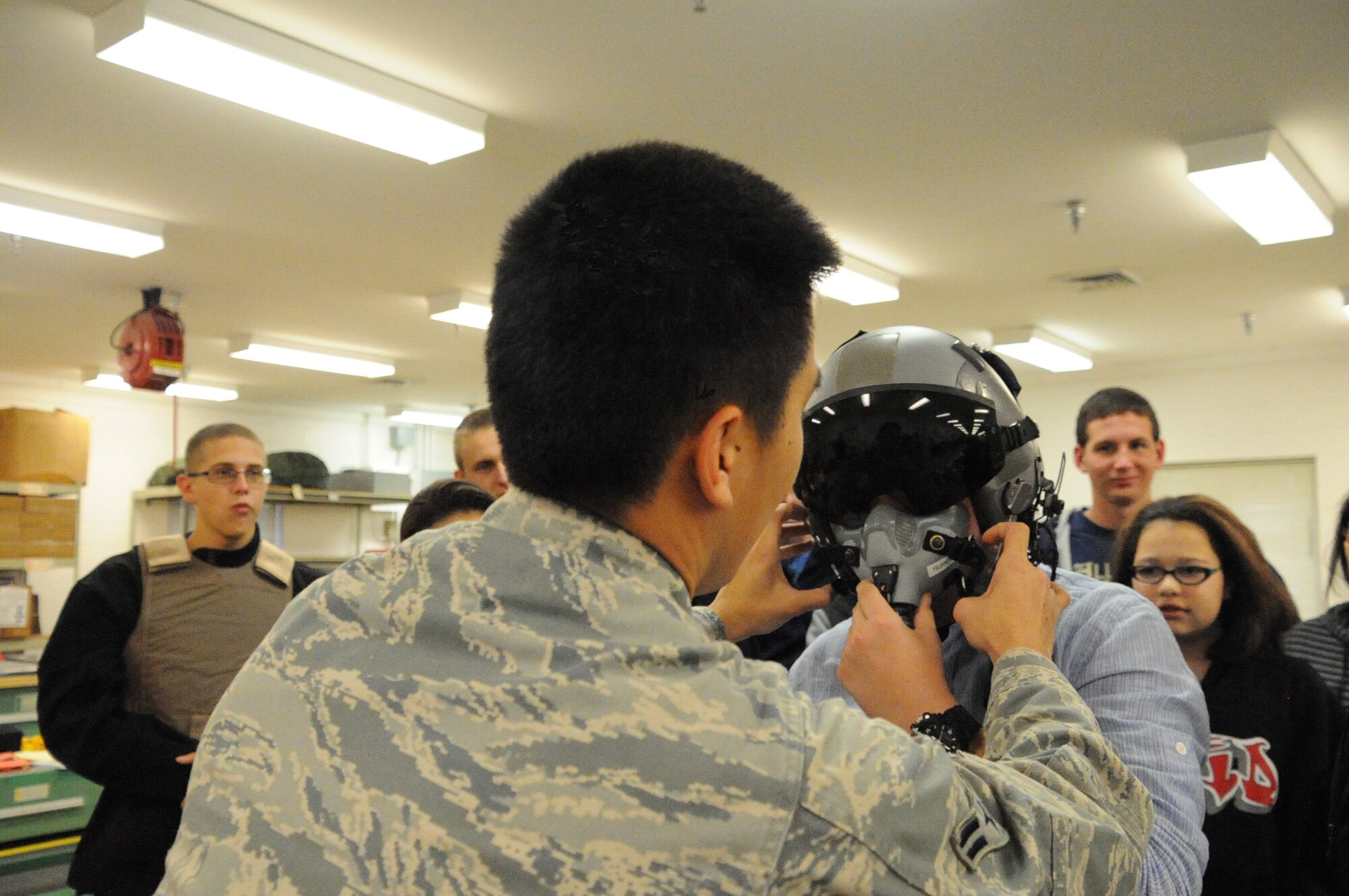 An Airman from the 437th Operations Support Squadron assists Civil Air Patrol C/MSgt Brandon Wynn during a tour of Charleston AFB, Saturday November 1. Members of the Clearwater Composite Squadron of the Civil Air Patrol took a ride on a C-17 Globemaster III to Charleston AFB on an Aerospace Education mission. (U.S. Air Force Photo/SSgt Adam Borgman)