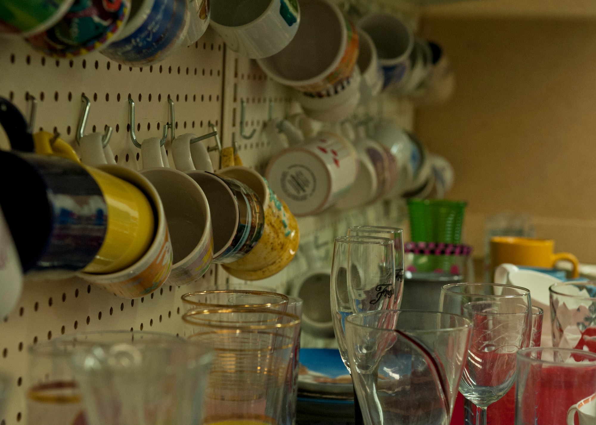 PETERSON AIR FORCE BASE, Colo. – Coffee mugs and other dishes are available for Airmen in need at the Airman’s Attic. The Airman’s Attic is a place where Airmen in grades E-5 and below can get household goods, clothes, children’s toys and miscellaneous items for free. Military uniforms are also available for free to all ranks. (U.S. Air Force photo/Airman 1st Class Rose Gudex)