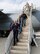 Honorary commanders Dawne Nickerson-Banez, 436th Logistics Readiness Squadron; Tom Banez, 436th Aerial Port Squadron; and John Yoho, 436th Maintenance Group, front to rear respectively, walk down the stairs leading from the troop compartment of a C-5M Super Galaxy  Oct. 29, 2014, at Dover Air Force Base, Del. Seventeen Team Dover honorary commanders went on a 2.7 hour flight that included air refueling with two Pennsylvania Air National Guard KC-135T Stratotankers from the 171st Air Refueling Wing, Pittsburgh International Airport, Pa. (U.S. Air Force photo/Roland Balik)