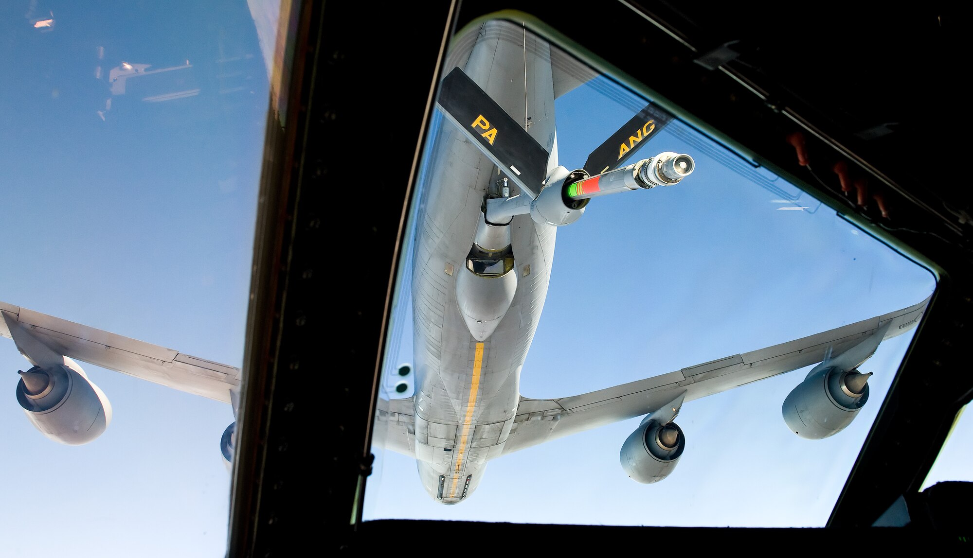 A pilot's view from the windshield of a C-5M Super Galaxy as it slowly approaches into position behind a Pennsylvania Air National Guard KC-135T Stratotanker from the 171st Air Refueling Wing, Pittsburgh International Airport, Pa. during an air refueling flight Oct. 29, 2014. An aircrew from the 9th Airlift Squadron, Dover Air Force Base, Del., took 17 Team Dover honorary commanders, unit commanders and public affairs ambassadors on a 2.7 hour flight demonstrating the air refueling capabilities of U.S. Air Force aircraft. (U.S. Air Force photo/Roland Balik)