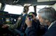 Allan Angel, Detachment 3, 373rd Training Squadron honorary commander, Dover Air Force Base, Del., right, takes a photo during an air refueling training flight Oct. 29, 2014. Capt. Neal Ballas, 9th Airlift Squadron pilot, Dover AFB, Del., helps position the C-5M Super Galaxy up to a KC-135T Stratotanker from the Pennsylvania Air National Guard, 171st Air Refueling Wing, Pittsburgh International Airport, Pa. (U.S. Air Force photo/Roland Balik)