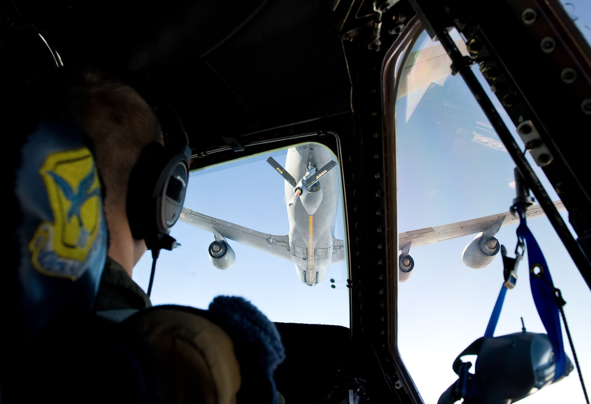 Capt. Neal Ballas, 9th Airlift Squadron pilot, Dover Air Force Base, Del., keeps an eye on a KC-135T Stratotanker while he helps position a C-5M Super Galaxy up to the refueler during an air refueling training flight Oct. 29, 2014,. Two Pennsylvania Air National Guard KC-135T Stratotankers from the 171st Air Refueling Wing, Pittsburgh International Airport, Pa. transferred 1,000 pounds of fuel each to the C-5M. (U.S. Air Force photo/Roland Balik)