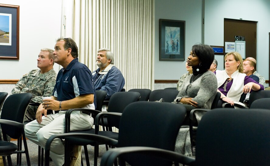 Team Dover honorary commanders listen to a C-5M Super Galaxy training mission briefing Oct. 29, 2014, at the 9th Airlift Squadron on Dover Air Force Base, Del. Seventeen honorary commanders went on a 2.7 hour flight that included air refueling with two Pennsylvania Air National Guard KC-135T Stratotankers from the 171st Air Refueling Wing, Pittsburgh International Airport, Pa. (U.S. Air Force photo/Roland Balik)