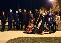 Halloween costume contestants pose for a group photo during a combined dinner and “Trunk-or-Treat” event sponsored by the Chief’s Group and Airmen Dorm Council Oct. 30, 2014, at Dover Air Force Base, Del. Attendees of the event were encouraged to come dressed up and gift cards were presented to the two best Halloween costumes. (U.S. Air Force photo/Airman 1st Class William Johnson)