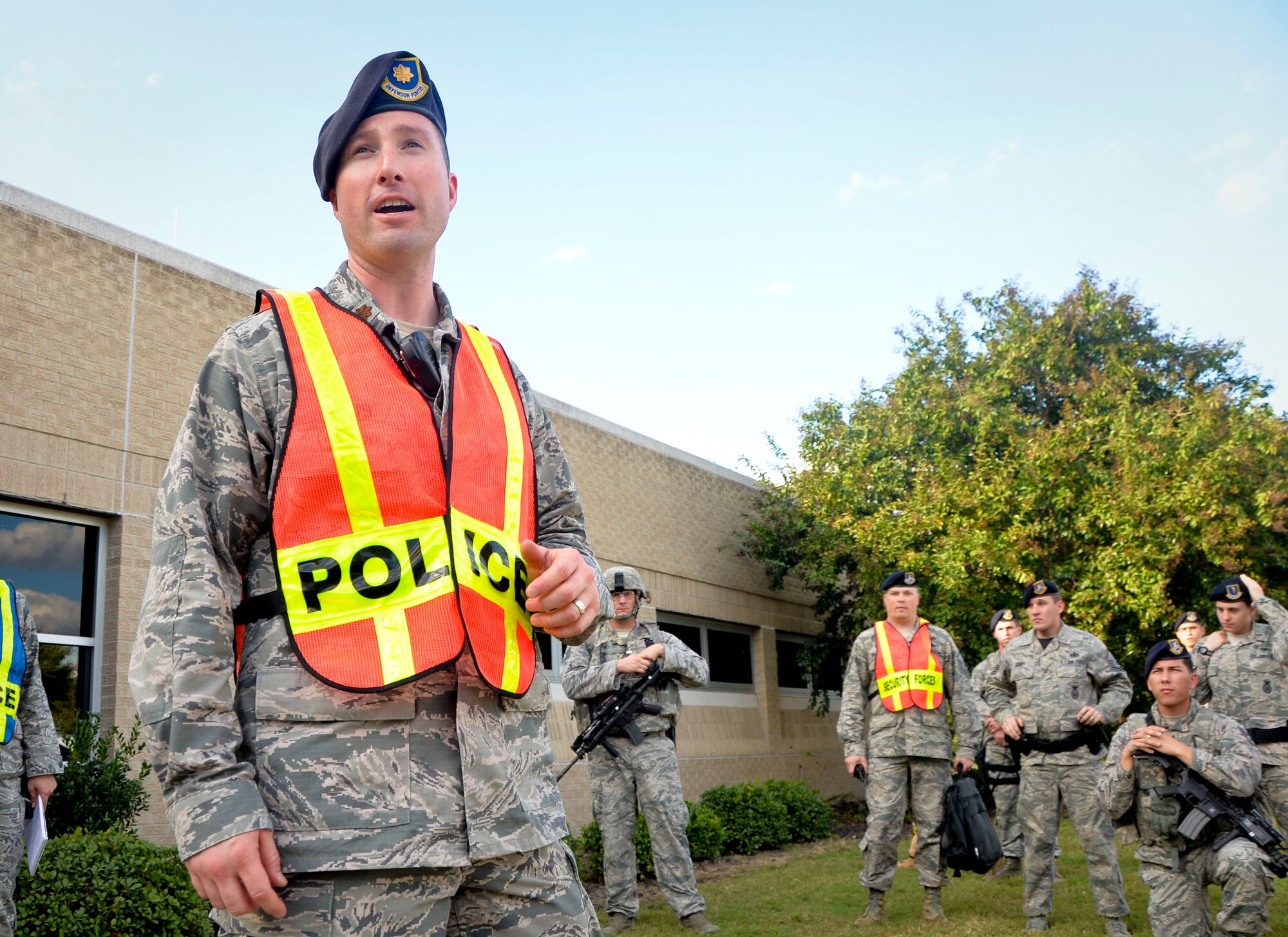 Maj. David Watts, 2nd Security Forces Squadron commander, debriefs Airmen during an active shooter exercise on Barksdale Air Force Base, La., Oct. 26, 2014. Watts congratulated Airmen on the effective use of tactics and speedy response making this a successful exercise. (U.S. Air Force photo/Airman 1st Class Mozer O. Da Cunha)