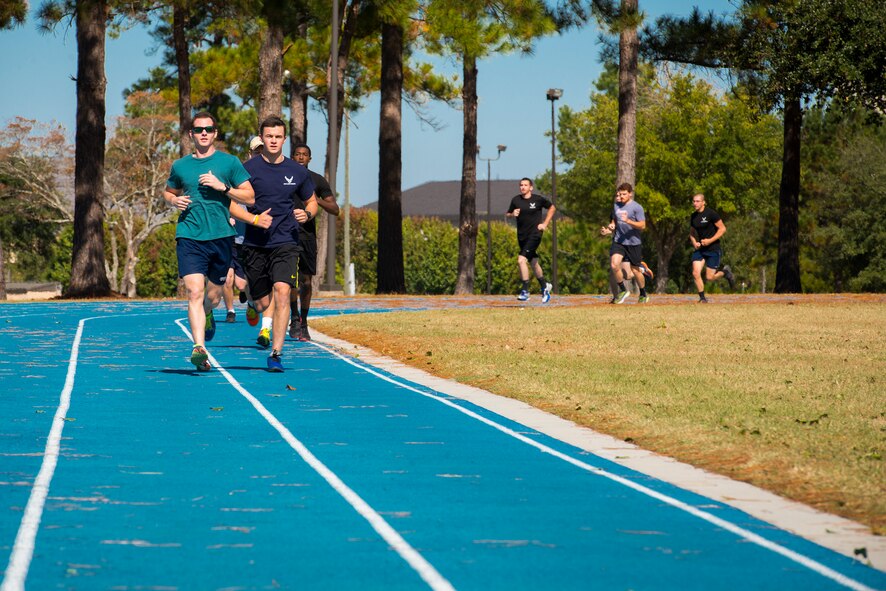 Members of the 336th Recruiting Squadron’s delayed entry program run laps as part of a physical ability and stamina test (PAST) Nov. 3, 2014, at Moody Air Force Base, Ga. The PAST includes an underwater and surface swim, running, push-ups, sit-ups and pull-ups. (U.S. Air Force photo by Airman 1st Class Ryan Callaghan/Released)