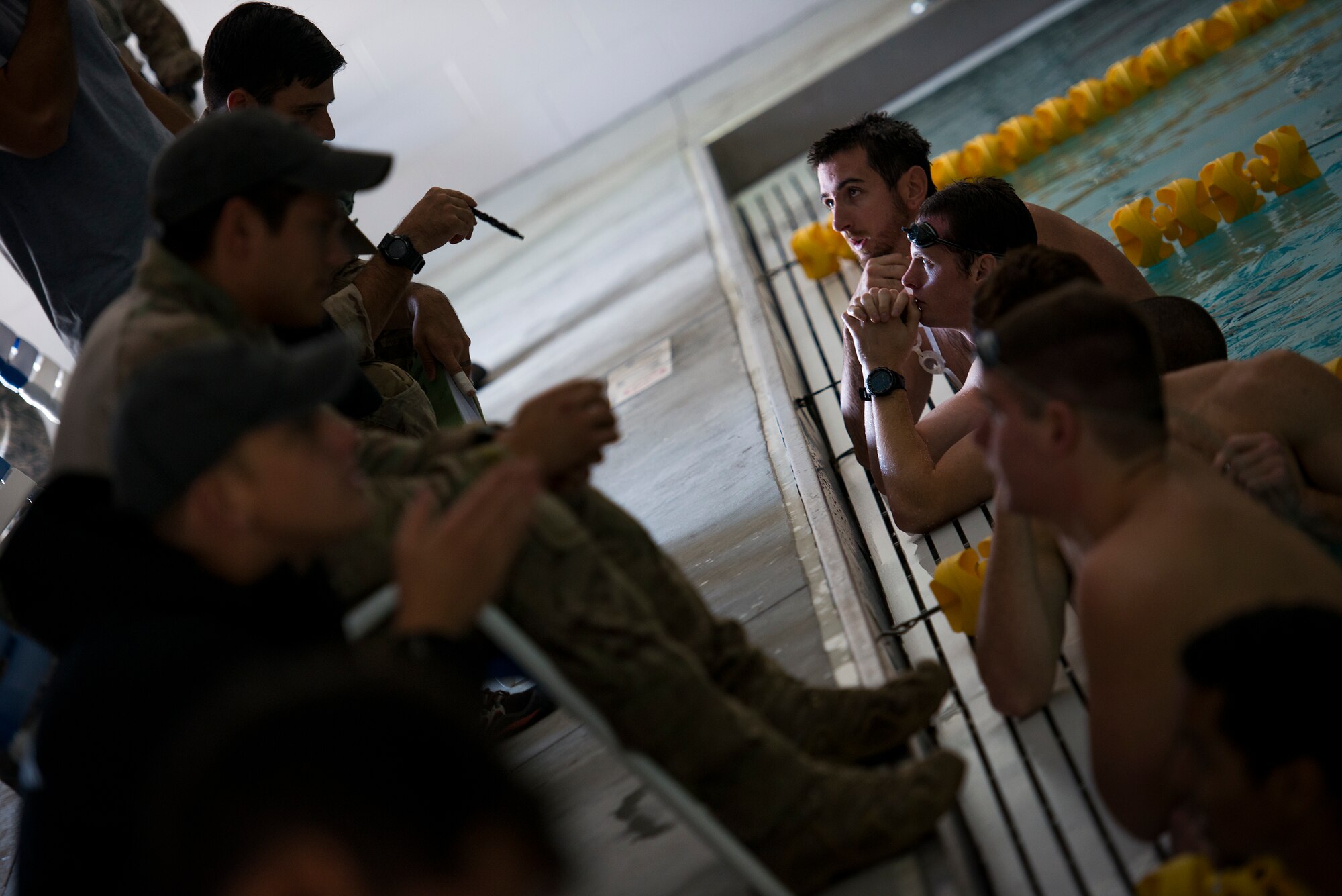 Members of the 336th Recruiting Squadron’s delayed entry program listen to swimming advice from 38th Rescue Squadron pararescuemen (PJs) Nov. 3, 2014, at Moody Air Force Base, Ga. The PJs gave the recruits tips and techniques to cater their training to Air Force standards. (U.S. Air Force photo by Airman 1st Class Ryan Callaghan/Released)