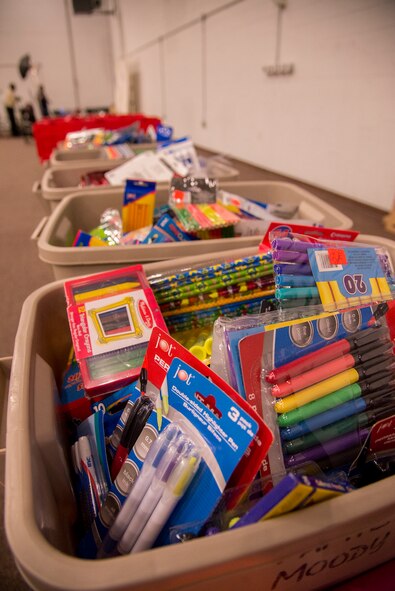 School supplies rest in bins during the Fall Festival for Deployed Families Oct. 30, 2014, at Moody Air Force Base, Ga. The Airman and Family Readiness Center provided free school supplies to guests in attendance. (U.S. Air Force photo by Senior Airman Sandra Marrero/Released)
