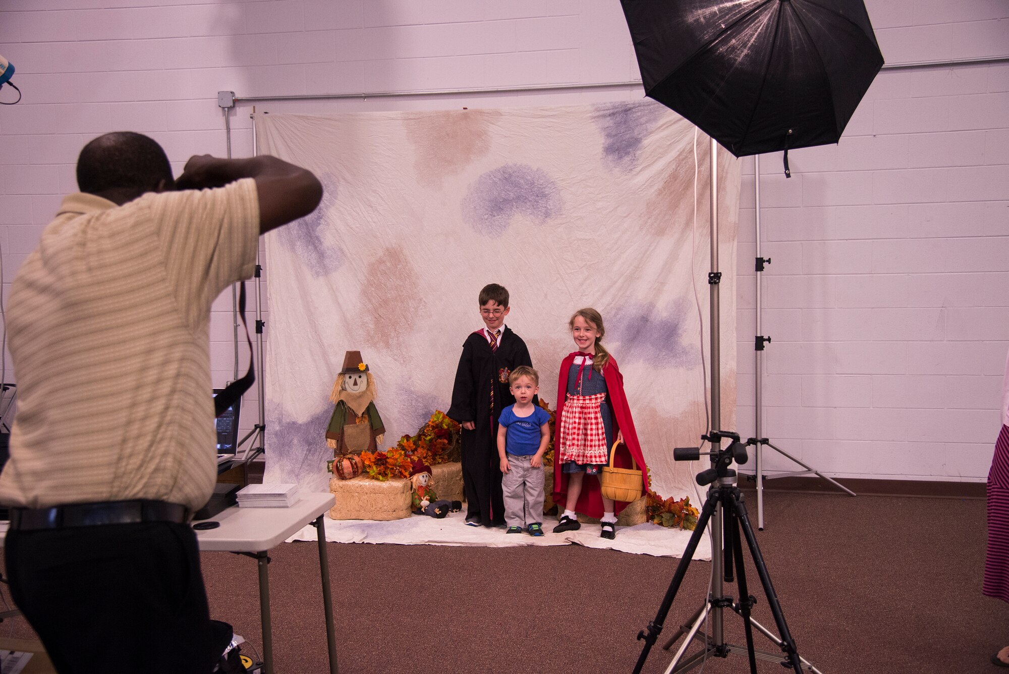 Children pose for a photo during the Fall Festival for Deployed Families Oct. 30, 2014, at Moody Air Force Base, Ga. The event included games as well as free portraits, goody bags and school supplies for the families of deployed Airmen. (U.S. Air Force photo by Senior Airman Sandra Marrero/Released)

