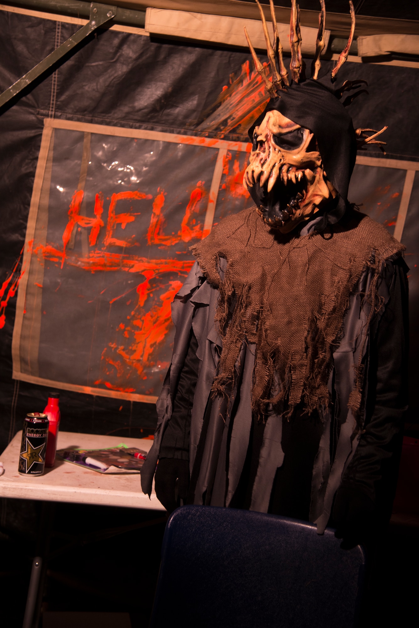 A volunteer waits to scare the first group of visitors at the 34th Annual Moody Air Force Base Haunted House Nov. 1, 2014, in Valdosta, Ga. Volunteers worked afterhours for three months to set up the haunted house. (U.S. Air Force photo by Senior Airman Sandra Marrero/Released)
