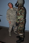 Air Force Reserve Senior Master Sgt. Vern Lewis, Noncommissioned Officer in Charge (NCOIC) of the 910th Airlift Wing’s Inspector General’s Office, checks the Mission Oriented Protective Posture (MOPP) gear of a Citizen Airman during a Chemical, Biological, Radiological, Nuclear and high yield Explosives (CBRNE) exercise during the Unit Training Assembly here, Nov. 2, 2014. The 910th Airlift Wing’s Inspector General’s Office conducted the CBRNE exercise with support from the 910th Civil Engineer Squadron Emergency Management Flight in an effort to give Servicemembers more training with their protective equipment. U.S. Air Force photo/ Tech. Sgt. Rick Lisum. 
