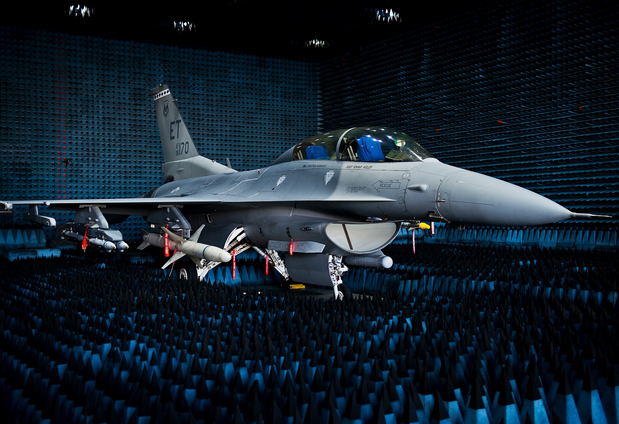 A 40th Flight Test Squadron F-16 Fighting Falcon sits in the anechoic chamber after completion of the initial round of testing simulations on the new M-7 software upgrade Oct. 30 at Eglin Air Force Base, Fla.  The M-7 software package will provide multiple advanced capabilities to the aircraft.  The anechoic chamber, located in the Joint Preflight Integration of Munitions and Electronic Systems building, is a room designed to stop reflections of either sound or electromagnetic waves. The room is insulated from exterior sources of noise.  JPRIMES provides an environment to facilitate testing air-to-air and air-to-surface munitions and electronics systems on full-scale aircraft and land vehicles prior to open air testing. (U.S. Air Force photo/Samuel King Jr.)