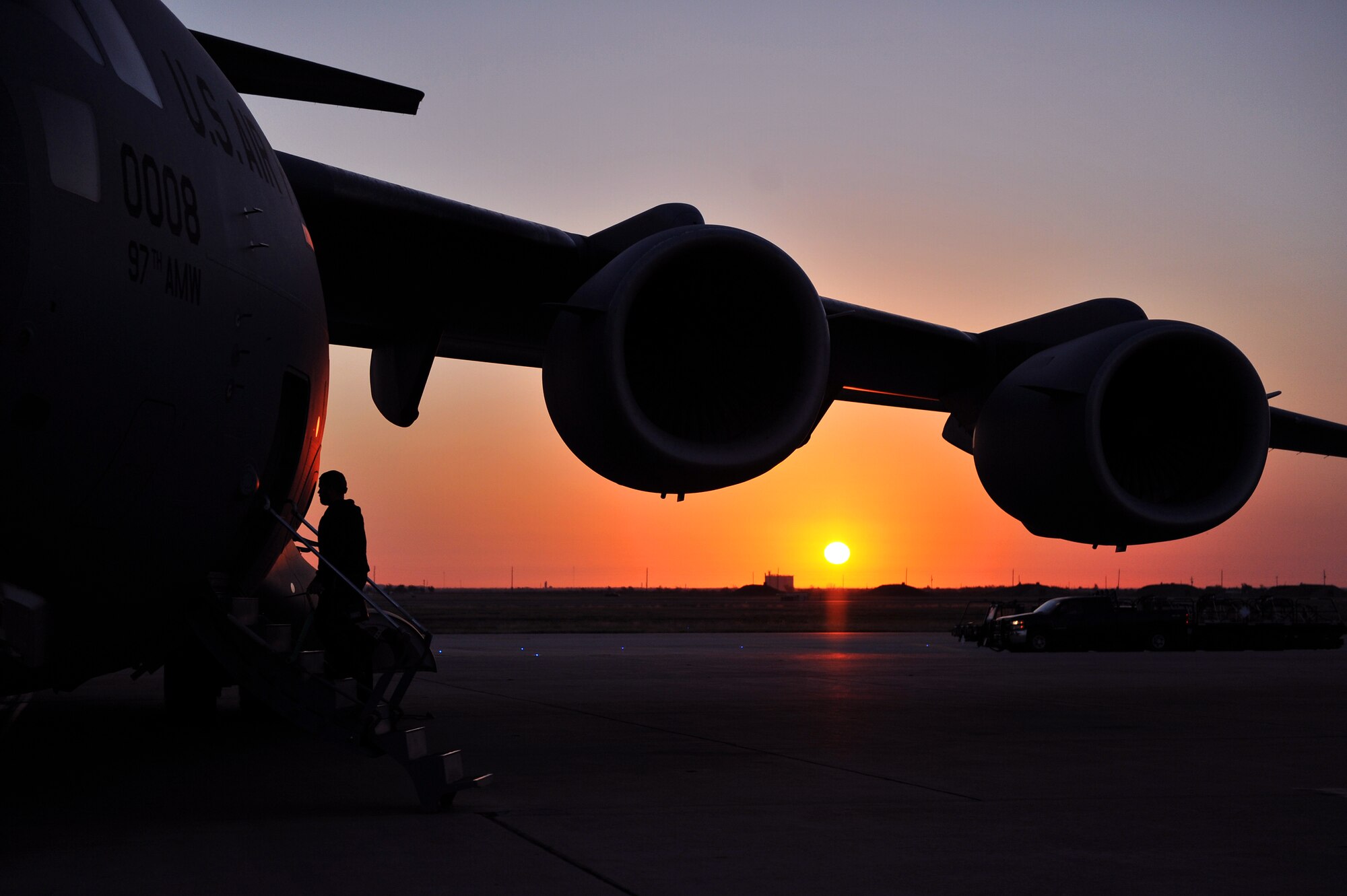 ALTUS AIR FORCE BASE, Okla. – A crew member from the 97th Air Mobility Wing boards a U.S. Air Force C-17 Globemaster III cargo aircraft before a training flight Oct. 30, 2014. The 58th Airlift Squadron’s mission is to train tomorrow’s C-17 pilots and loadmasters to support the U.S. Air Force and contingency operations worldwide. (U.S. Air Force Photo by Senior Airman Dillon Davis/Released)