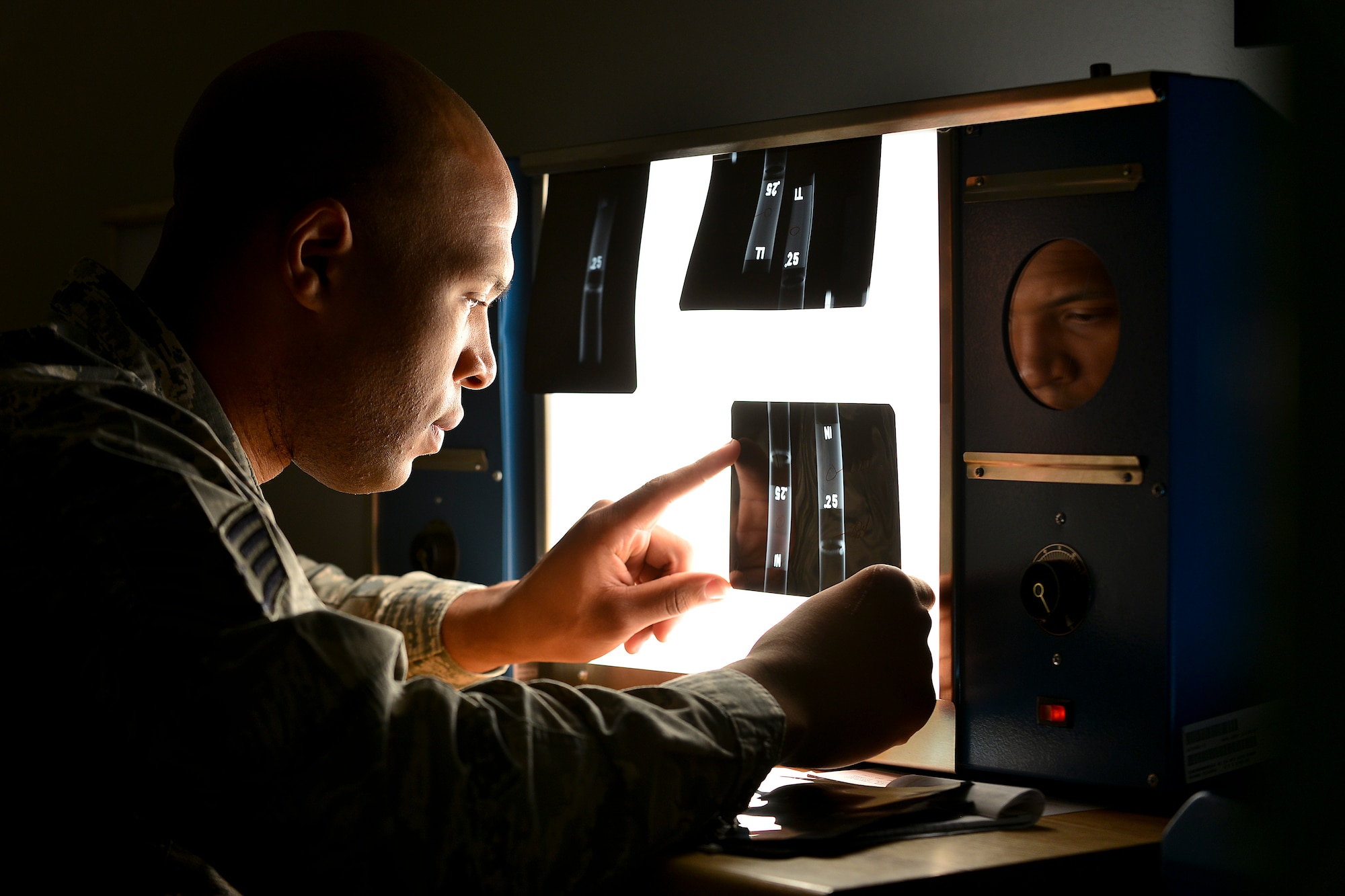U.S. Air Force Staff Sgt. Robert Eady, 1st Maintenance Squadron nondestructive inspection technician, conducts a well certification review at Langley Air Force Base, Va., Nov. 3, 2014. NDI technicians inspect foreign object debris discovered in an aircraft via X-ray. Debris, no matter the size, can lead to disastrous consequences if introduced into an aircraft engine. (U.S. Air Force photo by Staff Sgt. Antoinette Gibson/Released)
