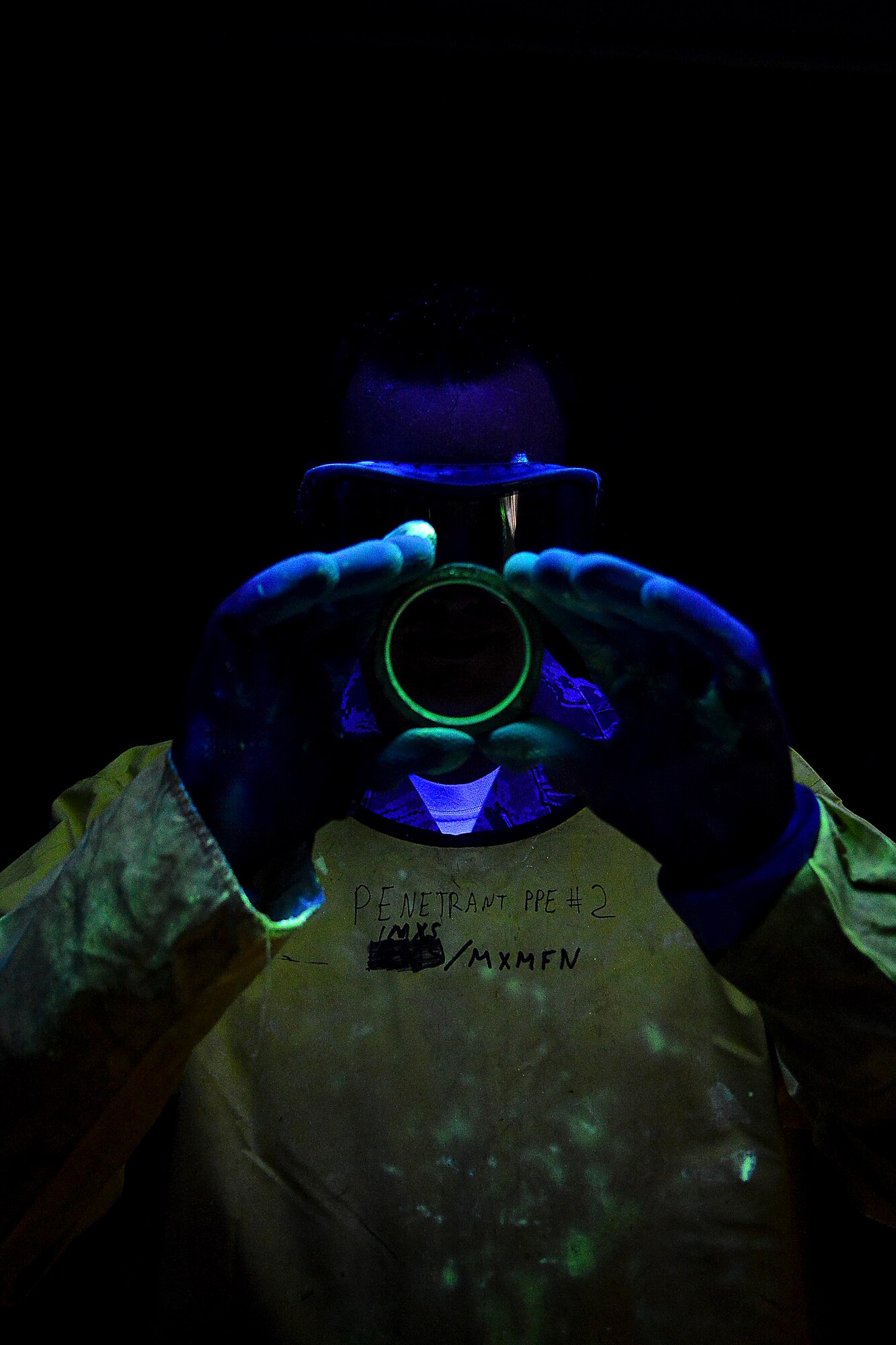 U.S. Air Force Airman 1st Class Michael Griffin, 1st Maintenance Squadron nondestructive inspection technician, inspects an aircraft part for cracks at Langley Air Force Base, Va., Nov. 3, 2014. The NDI personnel identify possible defects in aircraft systems and equipment. (U.S. Air Force photo by Staff Sgt. Antoinette Gibson/Released)