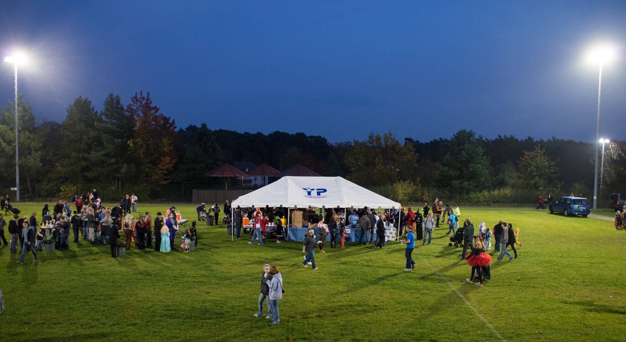 Children and parents attend Trunk or Treat Oct. 31, 2014, at Ramstein Air Base, Germany. Trick-or-treaters of all ages attended this year’s Trunk or Treat, which included food, movies, games, contests and candy. Courtesy photo (U.S. Air Force photo/Senior Airman Jonathan Stefanko)