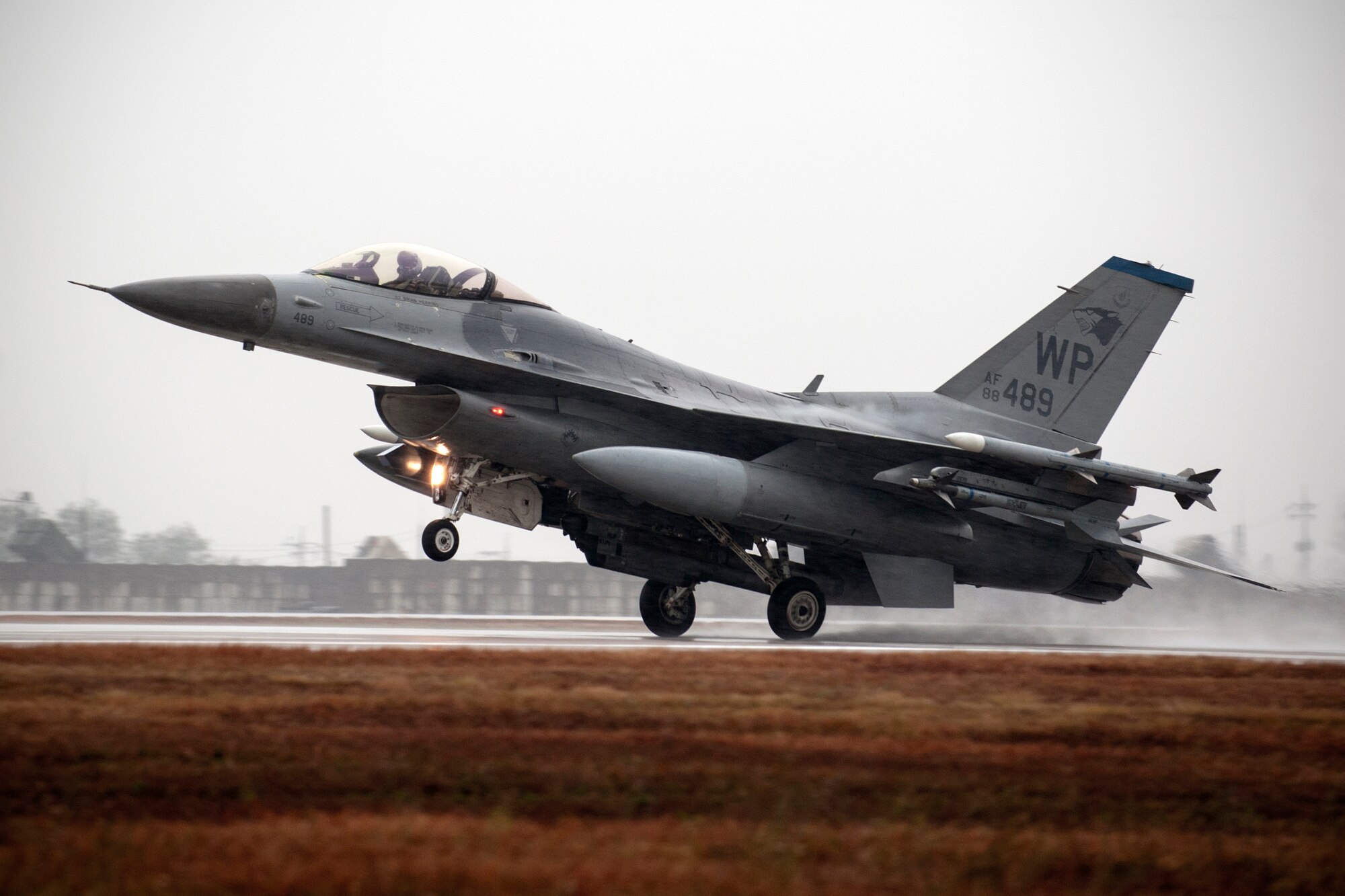 Wolf Pack F-16 Fighting Falcons land on the newly repaired runway at Kunsan Air Base, Republic of Korea, Oct. 31, 2014. The F-16s were landing for the first time after six weeks of runway repairs.  (U.S. Air Force photo by Senior Airman Taylor Curry/Released)  