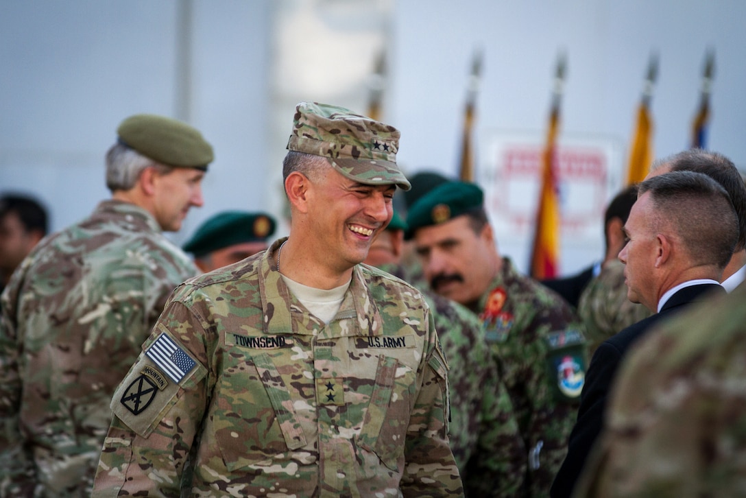 U.S. Army Maj. Gen. Stephen Townsend, left, commander of Combined Joint Task Force 10, talks to U.S. Ambassador to Afghanistan James Cunningham and senior civilian representative Cliff Heinzer before the deactivation ceremony on Bagram Airfield, Afghanistan, Nov. 4, 2014. CJTF 10 ended its mission in Regional Command East as the International Security Assistance Force transitioned to the Resolute Support mission.