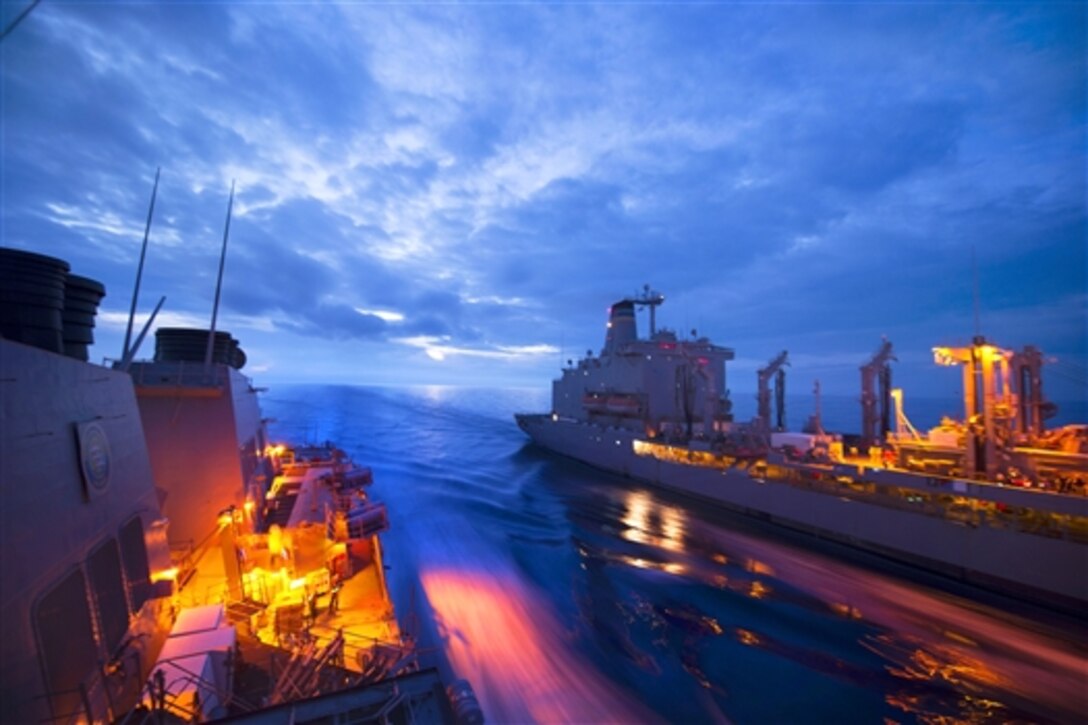 The USS Ross and the replenishment oiler USNS Leroy Grumman move parallel from each other in the Mediterranean Sea, Oct. 28, 2014, as a replenishment-at-sea operation takes place. 
