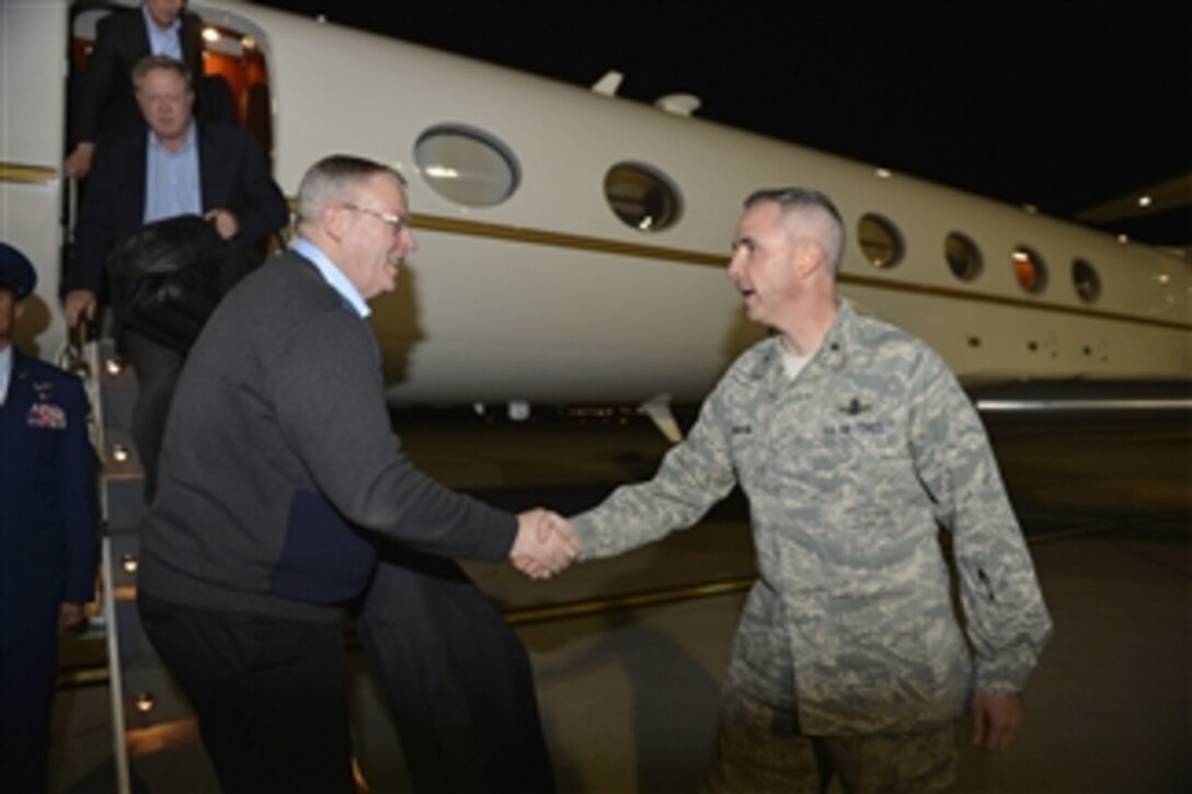 Deputy Defense Secretary Bob Work speaks with Air Force Brig. Gen. Stephen N. Whiting as he arrives on Nellis Air Force Base in Las Vegas, Nov. 3, 2014. Work is on a two day trip visiting military personnel on the West Coast. Whiting is vice commander of the U.S. Air Force Warfare Center.