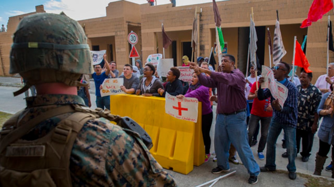 A Marine stands guard near the site of the Marine Battalion