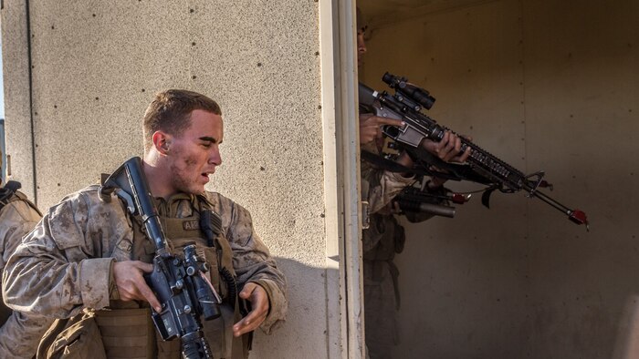 U.S. Marine Cpl. Jose W. Delgado rehearses immediate action drills with his squad during a vertical-assault raid course aboard Camp Pendleton, Calif., Oct. 27, 2014. Delgado is from Shirley, N.Y., and is a squad leader with Lima Company, Battalion Landing Team 3rd Battalion, 1st Marine Regiment, 15th Marine Expeditionary Unit. (U.S. Marine Corps photo by Sgt. Emmanuel Ramos/Released)