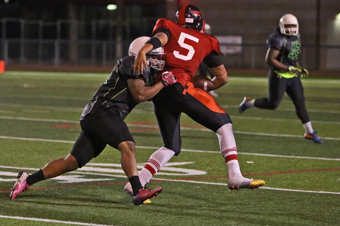 The Headquarters and Support Battalion Spartans claimed a hard fought victory against the Miramar Falcons, winning 7-0 during the Commanding General’s Cup Football Tournament Semi-Finals at the Paige Fieldhouse here, Nov. 4. The victory in overtime earned them a spot in the championship game against 1st Light Armored Reconnaissance Battalion Highlanders. (Photo by Cpl. Shaltiel Dominguez)