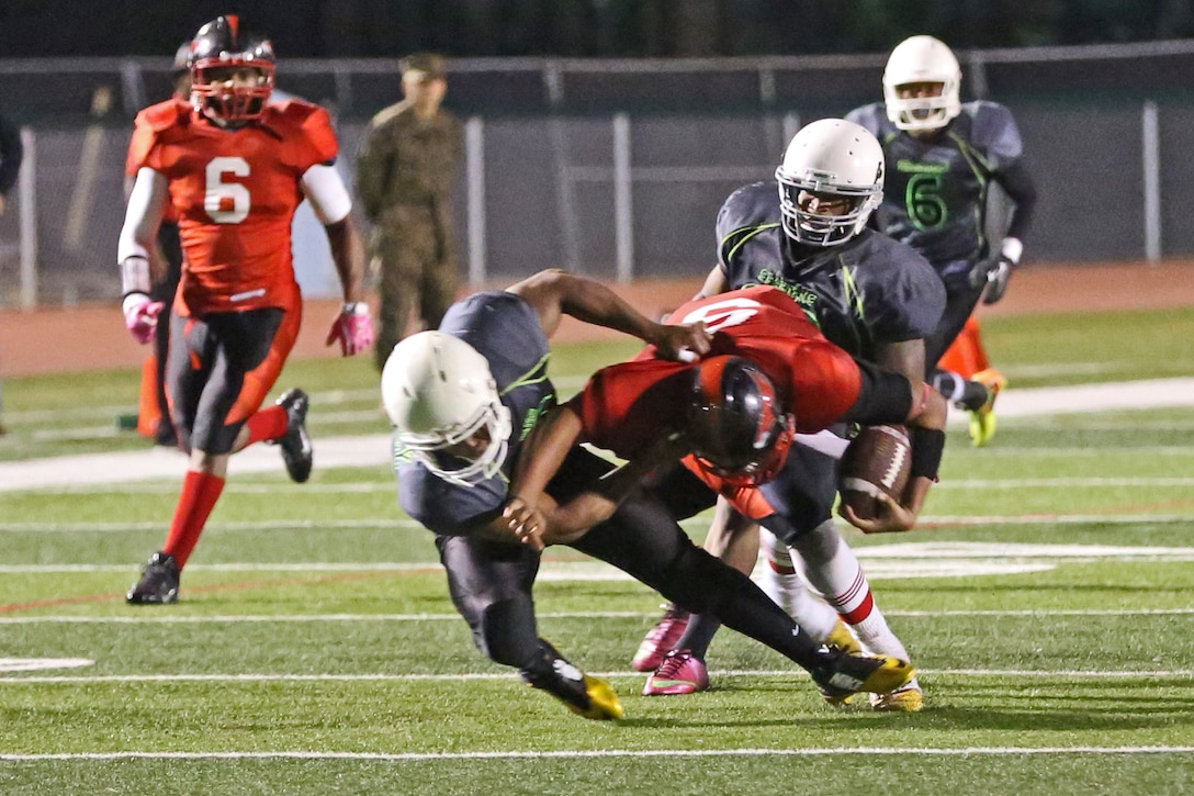 The Headquarters and Support Battalion Spartans claimed a hard fought victory against the Miramar Falcons, winning 7-0 during the Commanding General’s Cup Football Tournament Semi-Finals at the Paige Fieldhouse here, Nov. 4. The victory in overtime earned them a spot in the championship game against 1st Light Armored Reconnaissance Battalion Highlanders. (Photo by Cpl. Shaltiel Dominguez)