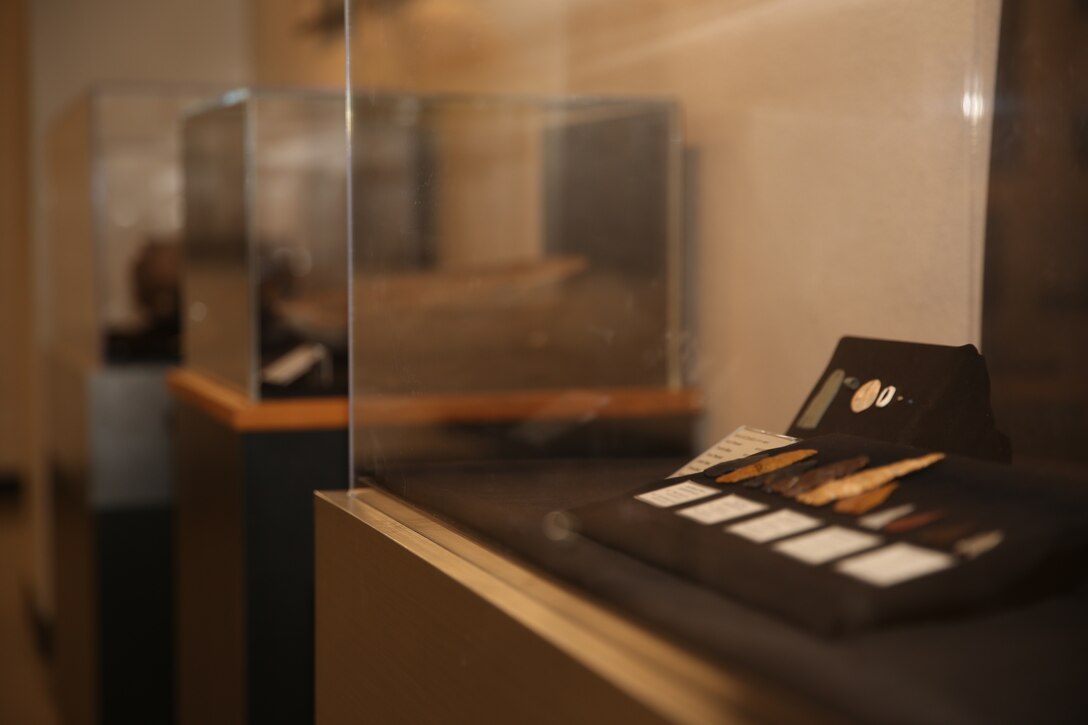 The Combat Center Archeological and Paleontological Curation Center unveiled its new exhibits displaying artifacts like arrowheads made of different stones found aboard the Combat Center, Oct. 29, 2014. Among the artifacts displayed was a thousand-year-old pot and a World War II-era Browning .50 caliber machine gun.