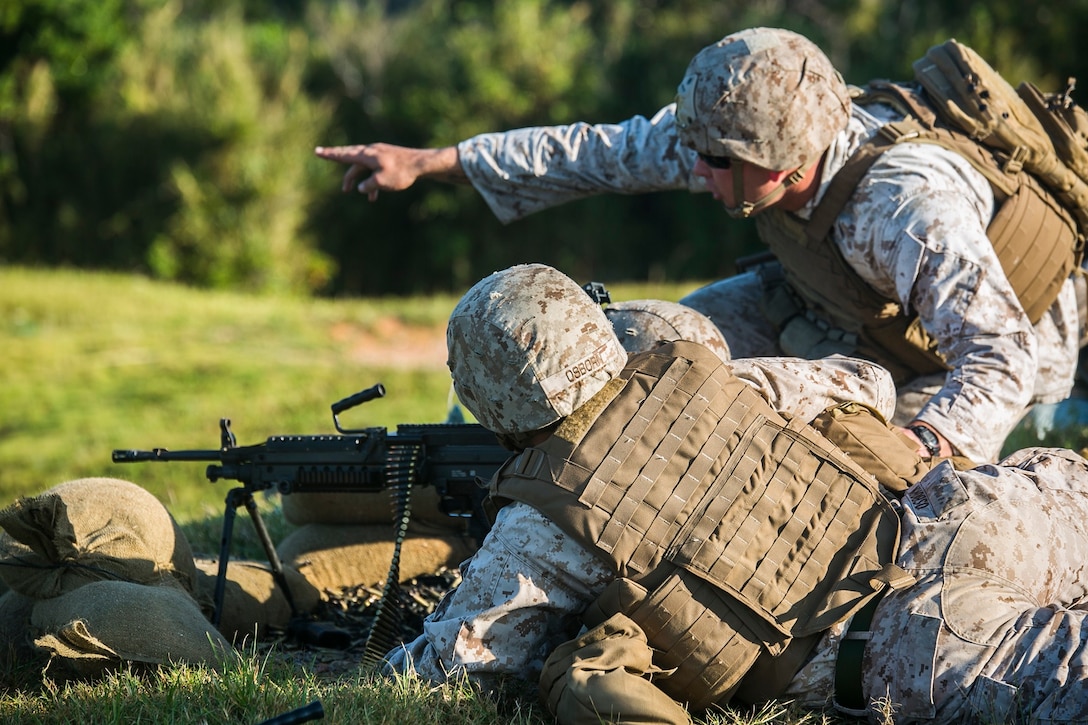 Marines operate an M240B medium machine gun Oct. 22 during the Air Naval Gunfire Liaison Company Basic Course on Camp Schwab. The M240B operates at a maximum rate of sustained fire of 100 rounds per minute, the rapid rate of fire is 200 rounds per minute, and the cyclic rate of fire is 650-950 rounds per minute. During rapid fire, the barrel should be changed every two minutes. The Marines trained to keep up their basic infantry skills and improve upon them. The Marines are with 5th ANGLICO, III Marine Expeditionary Force Headquarters Group, III MEF. (U.S. Marine Corps photo by Lance Cpl. Tyler S. Giguere/Released)