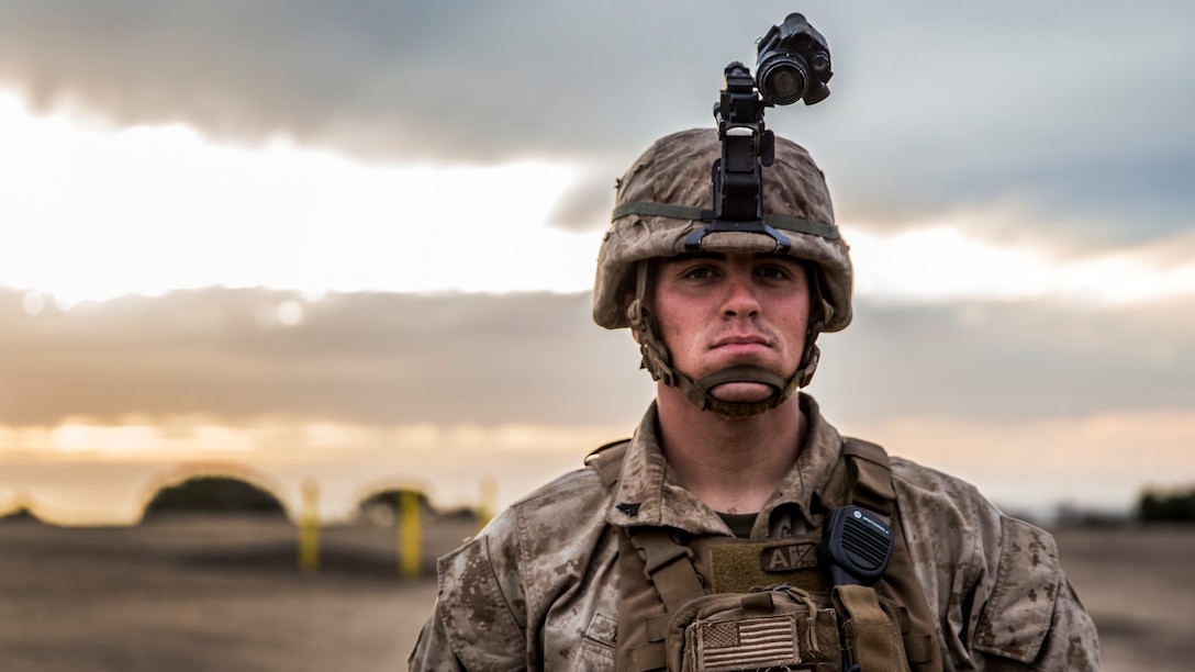 U.S. Marine Cpl. Jose W. Delgado prepares to lead his squad on a on a night raid exercise during a vertical-assault raid course aboard Camp Pendleton, Calif., Oct. 27, 2014. Delgado is from Shirley, N.Y., and is a squad leader with Lima Company, Battalion Landing Team 3rd Battalion, 1st Marine Regiment, 15th Marine Expeditionary Unit. (U.S. Marine Corps photo by Sgt. Emmanuel Ramos/Released)
