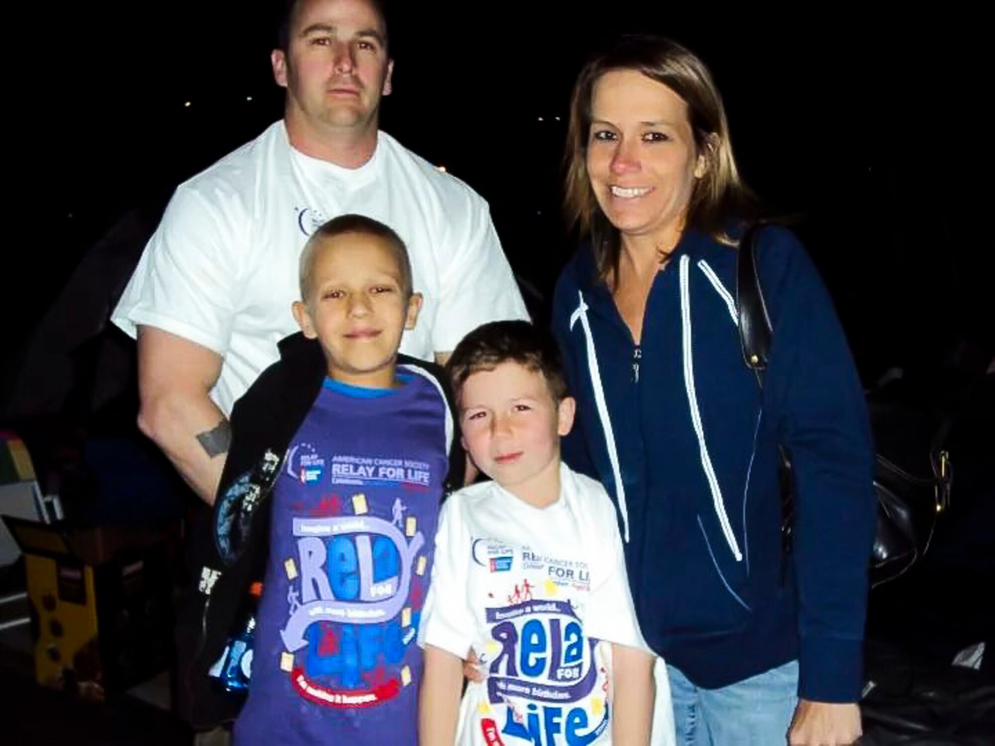 The Cooper family poses for a picture at a Relay for Life run event June 2010 in Las Vegas, Nev. Relay for Life is an organized, overnight community fundraising walk to raise money for the American Cancer Society. During the Survivors Lap, all cancer survivors at the event take the first walk around the track, celebrating their victory over cancer. (Courtesy photo)