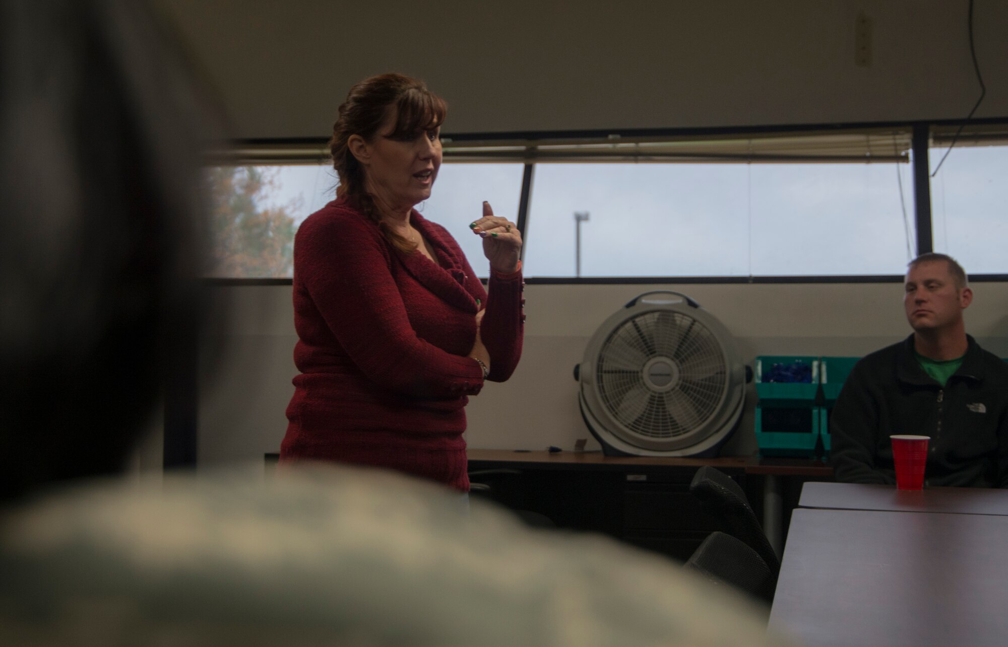Katherine Miller, 366th Fighter Wing sexual assault victim advocate, discusses sexual assault in the military during a Sexual Assault Prevention and Response meeting Oct. 31, 2014, at Mountain Home Air Force Base, Idaho. The meeting started off by watching a controversial video, “The Invisible War,” dealing with sexual assault in the military and ended with a thought-provoking discussion. (U.S. Air Force photo by Staff Sgt. Roy Lynch III/RELEASED)