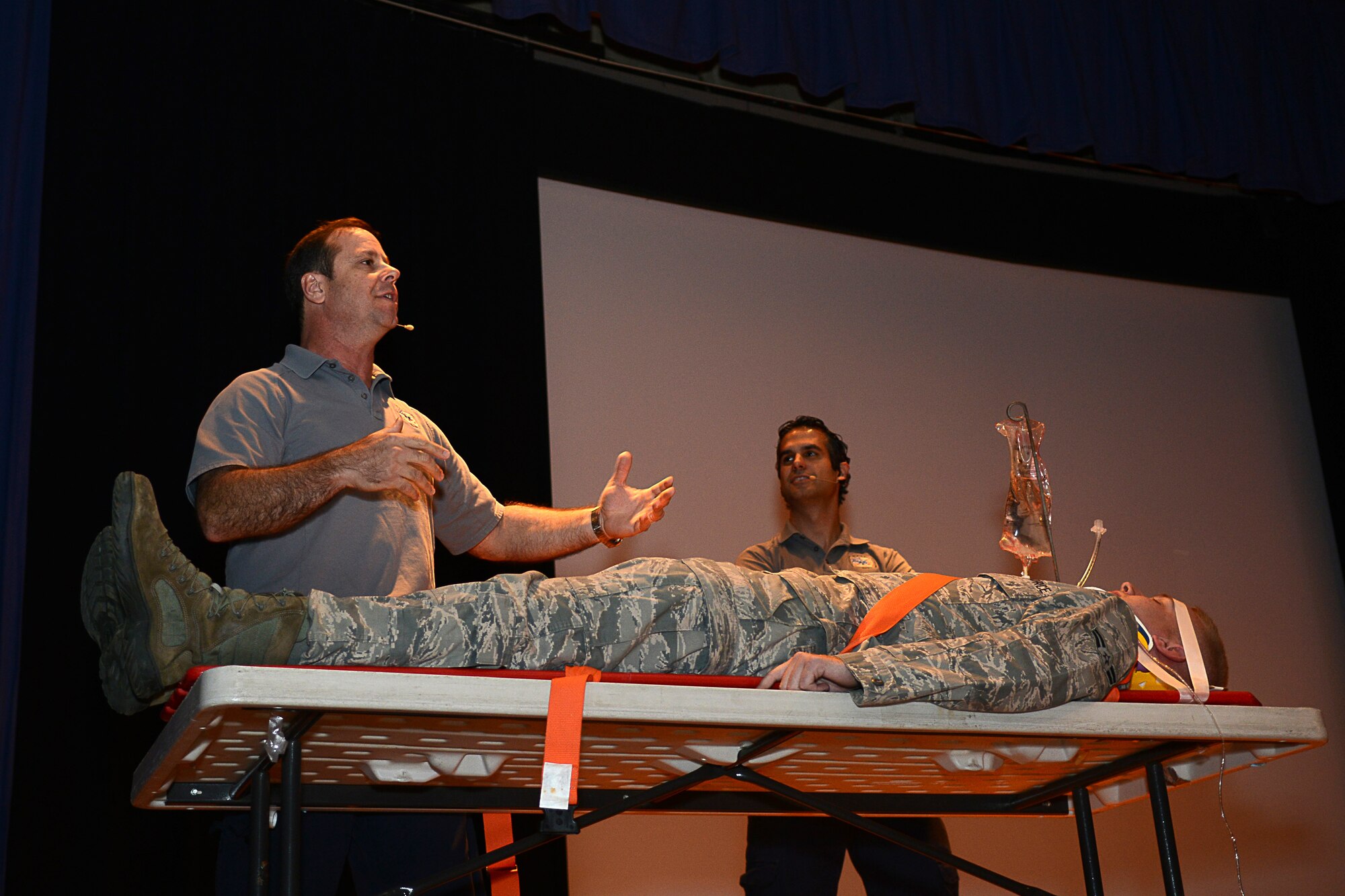 Ralph Jimenez and Oscar Duran, Miami-Dade County, Fla., Fire-Rescue paramedics, describe what happens to an emergency patient in a hospital after a debilitating vehicular accident at Langley Air Force Base, Va., Nov. 5, 2014. Jimenez and Duran spoke to the audience about the number and types of injuries a person may sustain to become a quadriplegic. (U.S. Air Force photo by Airman 1st Class Devin Scott Michaels/Released)