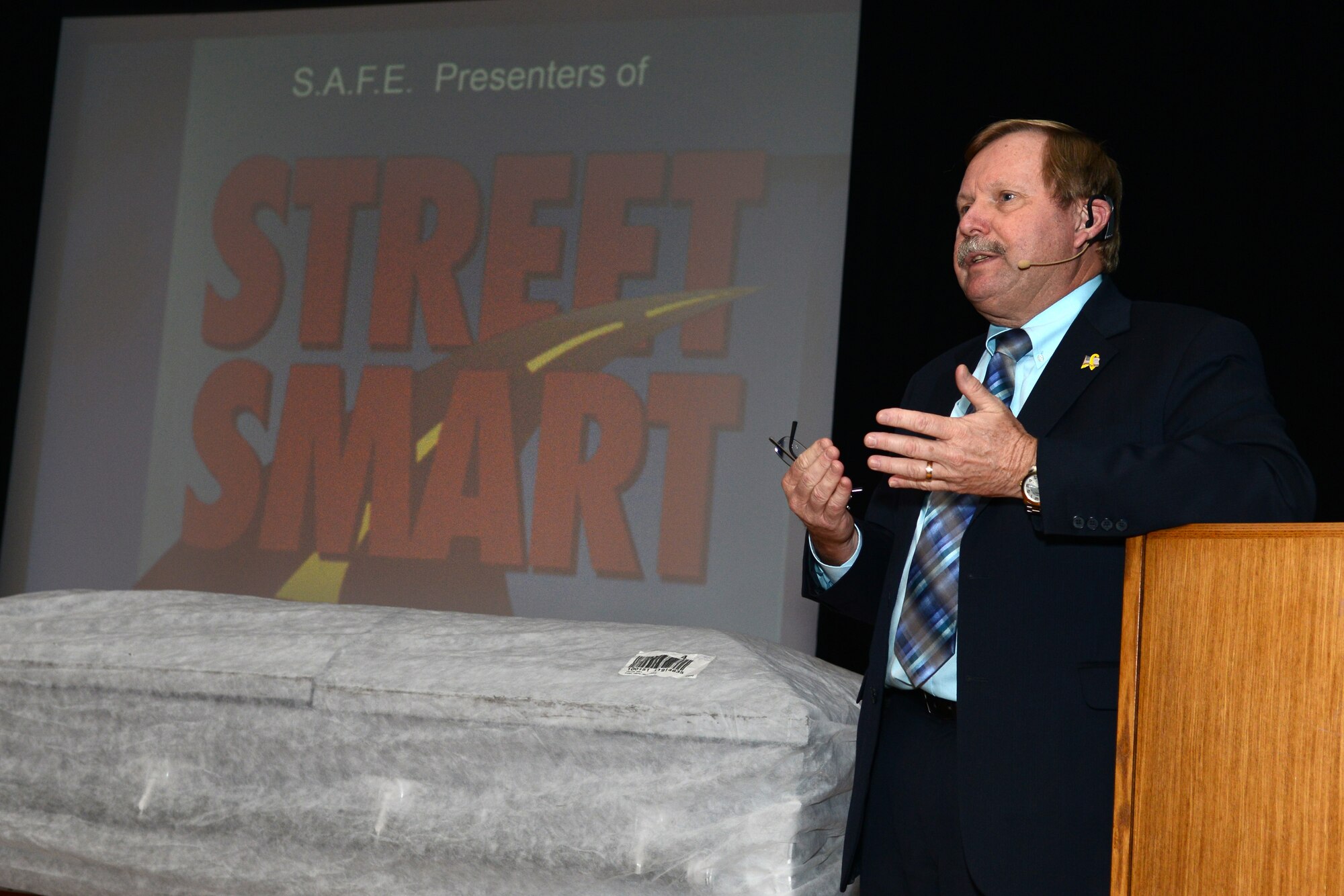 Robert Longworth, 633rd Air Base Wing Safety Office chief of safety, introduces the Street Smart presentation at Langley Air Force Base, Va., Nov. 5, 2014. Longworth informed the audience trauma is the leading cause of death for American ages 26 and younger. (U.S. Air Force photo by Airman 1st Class Devin Scott Michaels/Released)