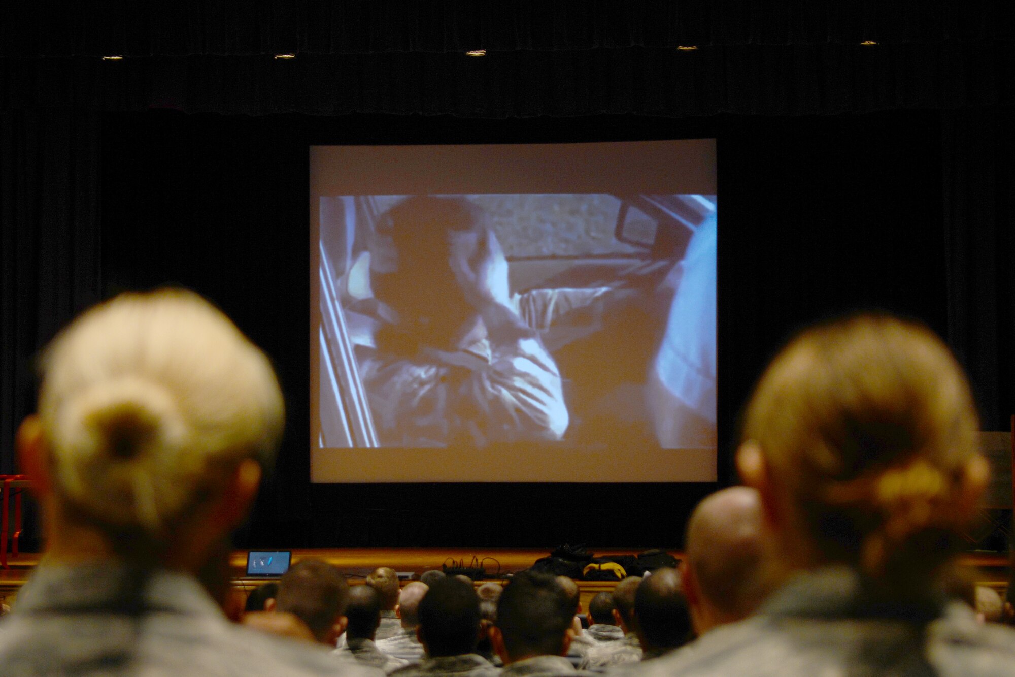 U.S. Air Force Airmen watch vehicle safety videos before a Street Smart presentation at Langley Air Force Base, Va., Nov. 5, 2014. The videos demonstrate the potential repercussions of unsafe driving habits, including driving under the influence and distracted driving. (U.S. Air Force photo by Airman 1st Class Devin Scott Michaels/Released)