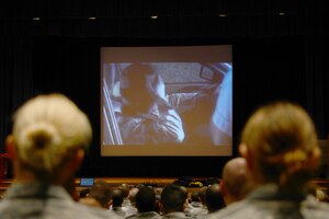 U.S. Air Force Airmen watch vehicle safety videos before a Street Smart presentation at Langley Air Force Base, Va., Nov. 5, 2014. The videos demonstrate the potential repercussions of unsafe driving habits, including driving under the influence and distracted driving. (U.S. Air Force photo by Airman 1st Class Devin Scott Michaels/Released)