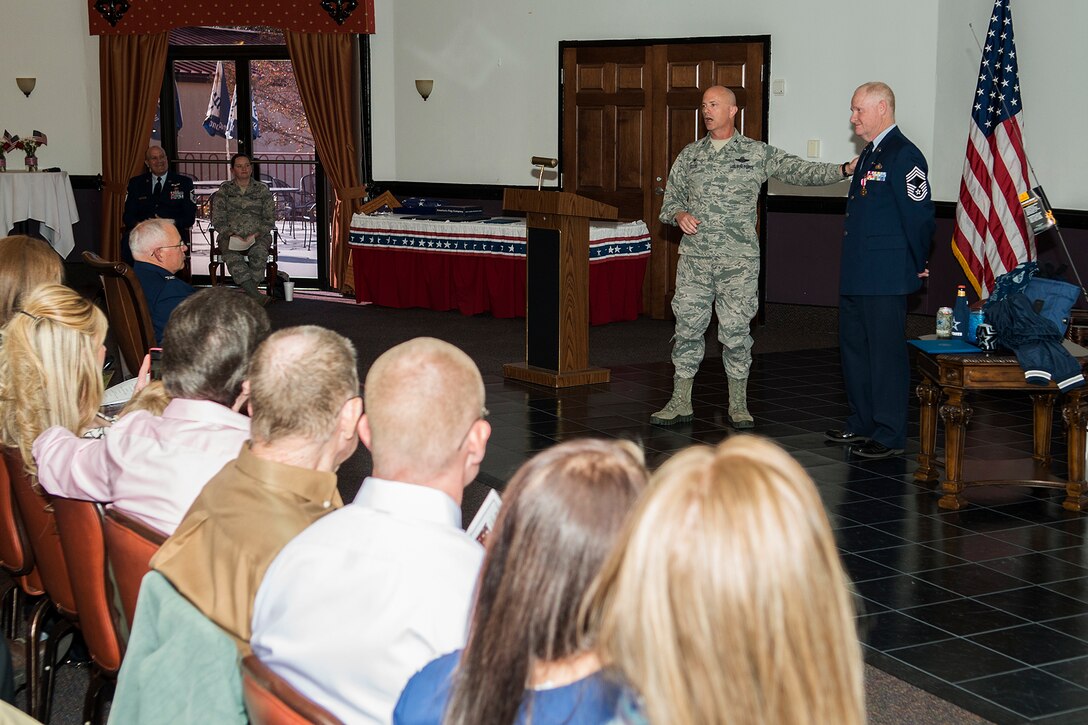 U.S. Air Force Col. Jonathan Ellis, 307th Bomb Wing commander, speaks during the retirement ceremony for Chief Master Sgt. Douglas McClain, Nov. 1, 2014, Barksdale Air Force Base, La. McClain is the Squadron Superintendent for the 307th Force Support Squadron and is retiring after more than 30 years of military service. (U.S. Air Force photo by Master Sgt. Greg Steele/Released)