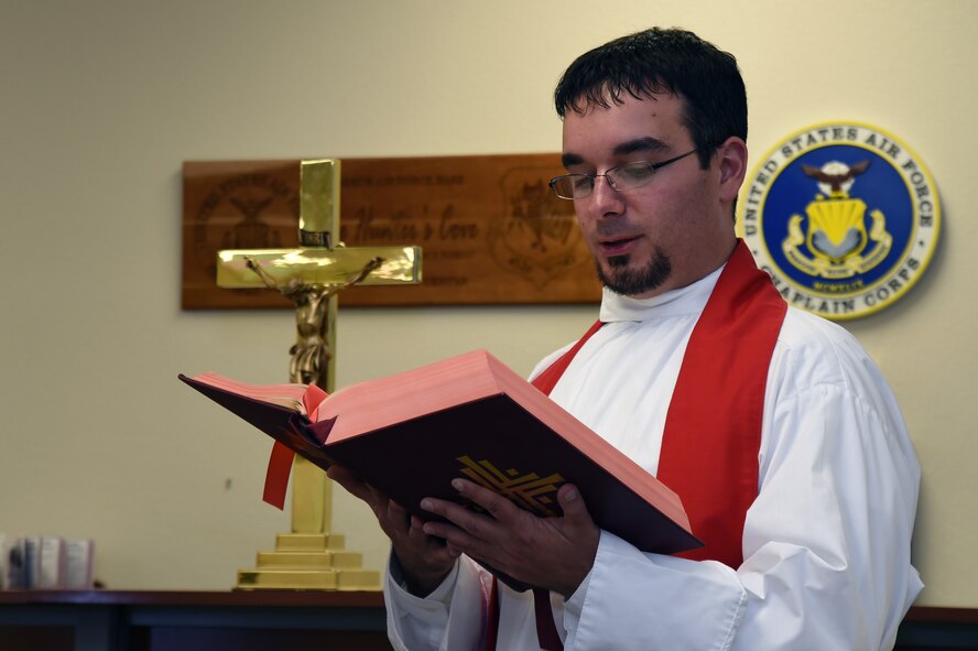 Father Brad Guillory, Roman Catholic Chaplain recruit, participates in Mass on Creech Air Force Base as part of the “Come Be With Us” chaplain recruiting tour Oct. 28, 2014. The Chaplain Corps held the annual tour to introduce potential Air Force recruits to military culture. (U.S. Air Force photo by Tech. Sgt. Shad Eidson/Released)