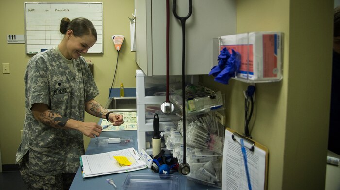 Army Spc. Valeria Montes, 628th Medical Group veterinarian, tests a pet’s urine sample Nov. 4, 2014, at the Veterinarian Treatment Facility on Joint Base Charleston, S.C. The urinalysis can provide veterinarians information about the kidneys and bladder, the liver, pancreas and other organs, allowing veterinarians to determine a prognosis  and treatment plan. (U.S. Air Force photo/Airman 1st Class Clayton Cupit)