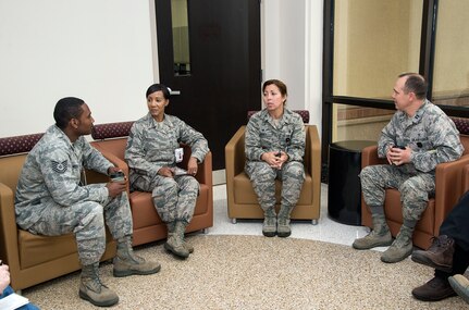 Col. Dana James, 359th Medical Group commander (third from left), and Chief Master Sgt. Sonya Stoute, 359th MDG superintendent (second from left), discuss patient care with Tech. Sgt. Jean-Baptiste Museau (at left) and Capt. David Wooten (at right) Nov. 4, 2014 at Joint Base San Antonio-Randolph The 359th MDG held a “Free Coffee with Commanders” event to offer patients and staff a free cup of coffee and an opportunity to discuss patient care experiences with medical group leaders. Museau is bioenvironmental engineering flight chief with the 359th Aerospace Medicine.  Wooten is officer in charge of Occupational Health & Readiness with the 359th Aerospace Medicine. (U.S. Air Force photo by Johnny Saldivar)

