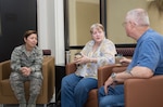 Col. Dana James, 359th Medical Group commander, discusses patient care experience with Francis Glowacz, retired Air Force veteran, and his wife, Henrietta, Nov. 4, 2014 at Joint Base San Antonio-Randolph. The 359th MDG held a “Free Coffee with Commanders” event to offer patients and staff a free cup of coffee and an opportunity to discuss patient care experiences with medical group leaders. (U.S. Air Force photo by Johnny Saldivar)