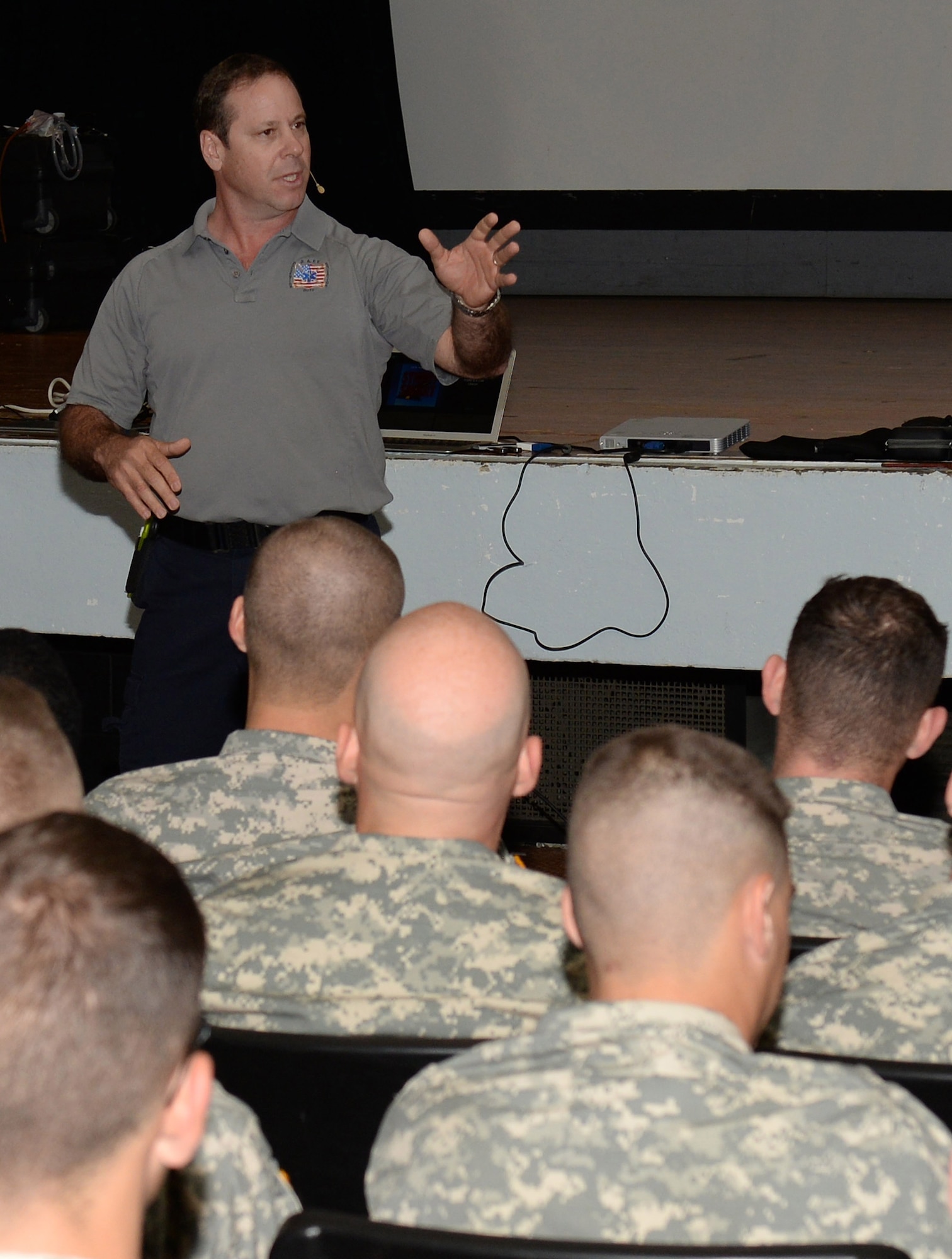 Ralph Jimenez, Miami-Dade County, Fla., Fire-Rescue paramedic and co-founder of Florida SAFE Inc., explains risks involved in distracted driving to U.S. Army Soldiers during the Stay Alive From Education Street Smart Program at Fort Eustis, Va., Nov. 4, 2014. The Street Smart presenters shared personal stories from real-life experiences as paramedics to express the risks involved with poor driving decisions. (U.S. Air Force photo by Staff Sgt. Teresa J. Cleveland/Released)