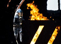 A 919th Special Operations Wing firefighter enters the aircraft during a training exercise at Eglin Air Force Base, Fla., Oct. 31.  The reserve firefighters from Duke Field used Eglin’s aircraft fire pit to meet their annual training requirements.  (U.S. Air Force photo/Tech. Sgt. Sam King)