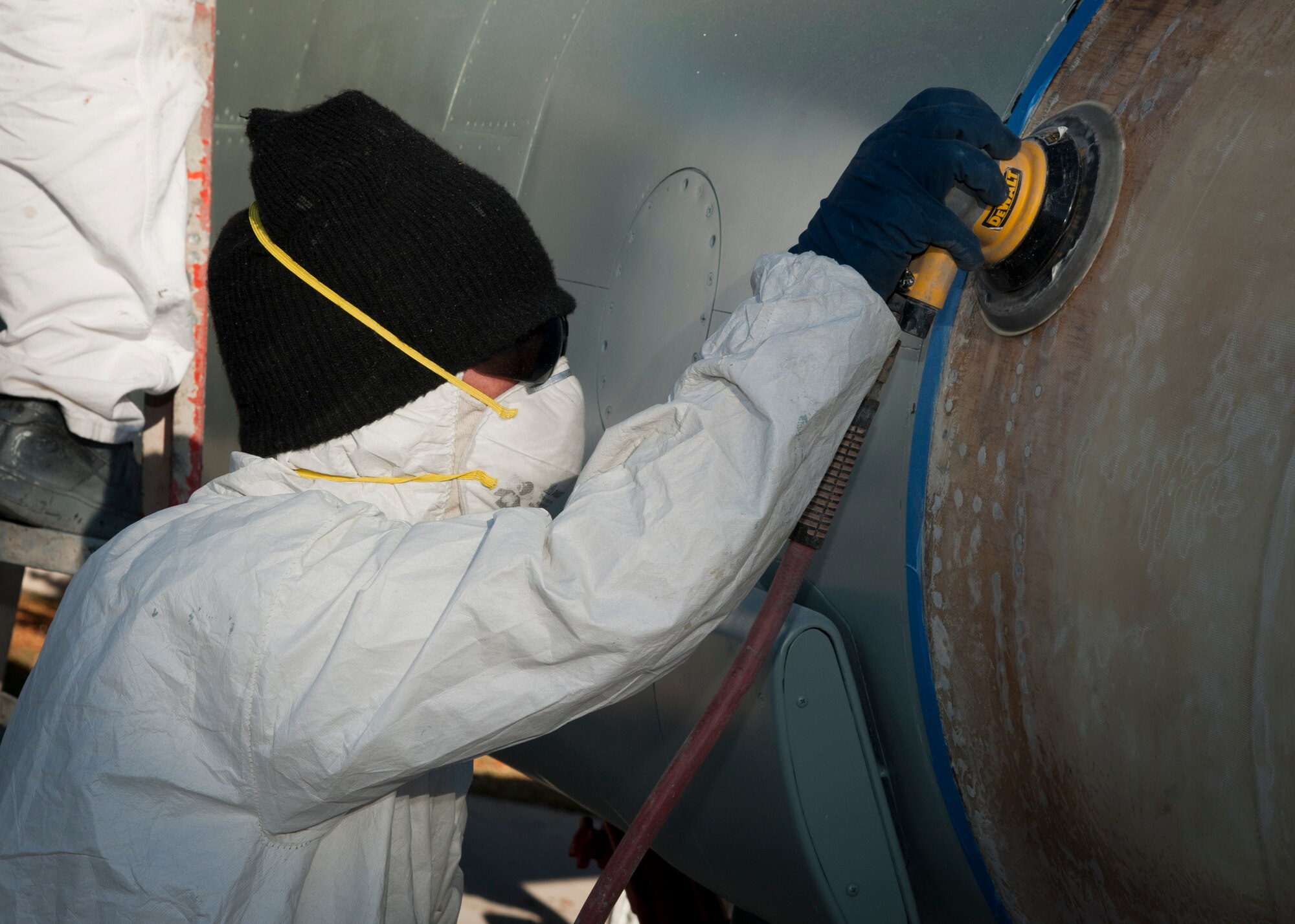 PETERSON AIR FORCE BASE, Colo. – Joe Durossette, a painting contractor, sands the nose of an F-4 Phantom II aircraft in preparation for paint at the base museum Oct. 30. Durossette is part of a contracted crew hired to repaint and touch up 10 aircraft maintained by the museum to ensure these artifacts remain accurate representations of these once high-soaring crafts that now reside at Peterson AFB. (U.S. Air Force photo/Staff Sgt. J. Aaron Breeden)