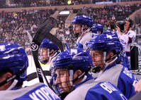 Members of the Air Force Academy Falcons hockey team look intently throughout the top of the third period during the Hockey Hall of Fame game against the University of North Dakota Nov. 1, 2014, at the Ralph Engelstad Arena in Grand Forks, N.D. The University of North Dakota took the victory with six seconds left in overtime winning 3-2. (U.S. Air Force photo/Airman 1st Class Bonnie Grantham)