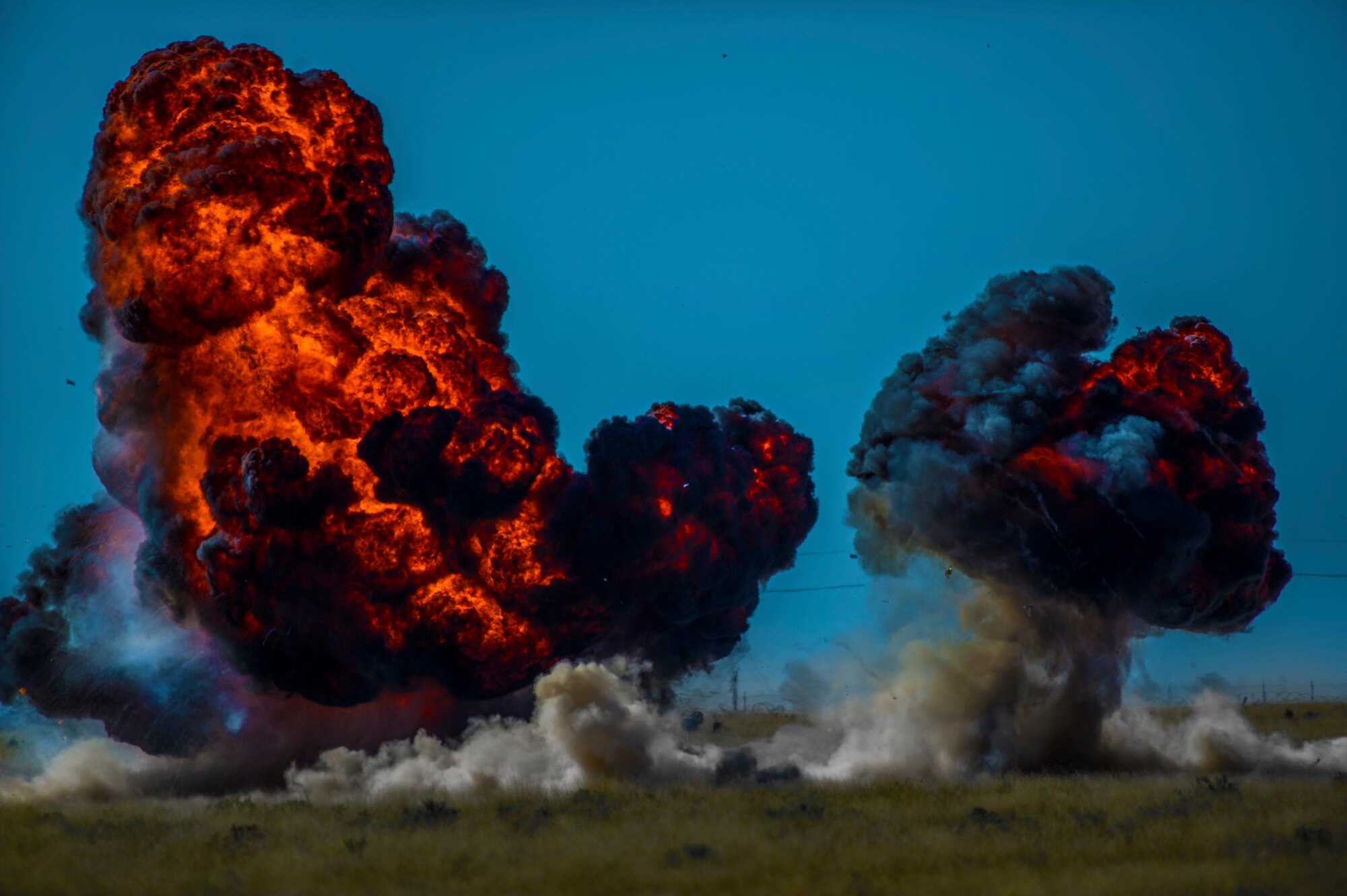 Explosives are detonated during the inaugural blast of a new demolition range located at Holloman Air Force Base, N.M., Oct. 28. The 49th Civil Engineer Squadron Explosive Ordnance Disposal technicians opened a new demolition range on Holloman and detonated 50 pounds of explosives to commemorate it’s activation. EOD technicians handle live explosives on a daily basis, and they use that knowledge to detect, identify, recover and dispose of explosives and ordnance that are unsafe or could pose a threat. (U.S. Air Force photo by Airman 1st Class Aaron Montoya / Released)